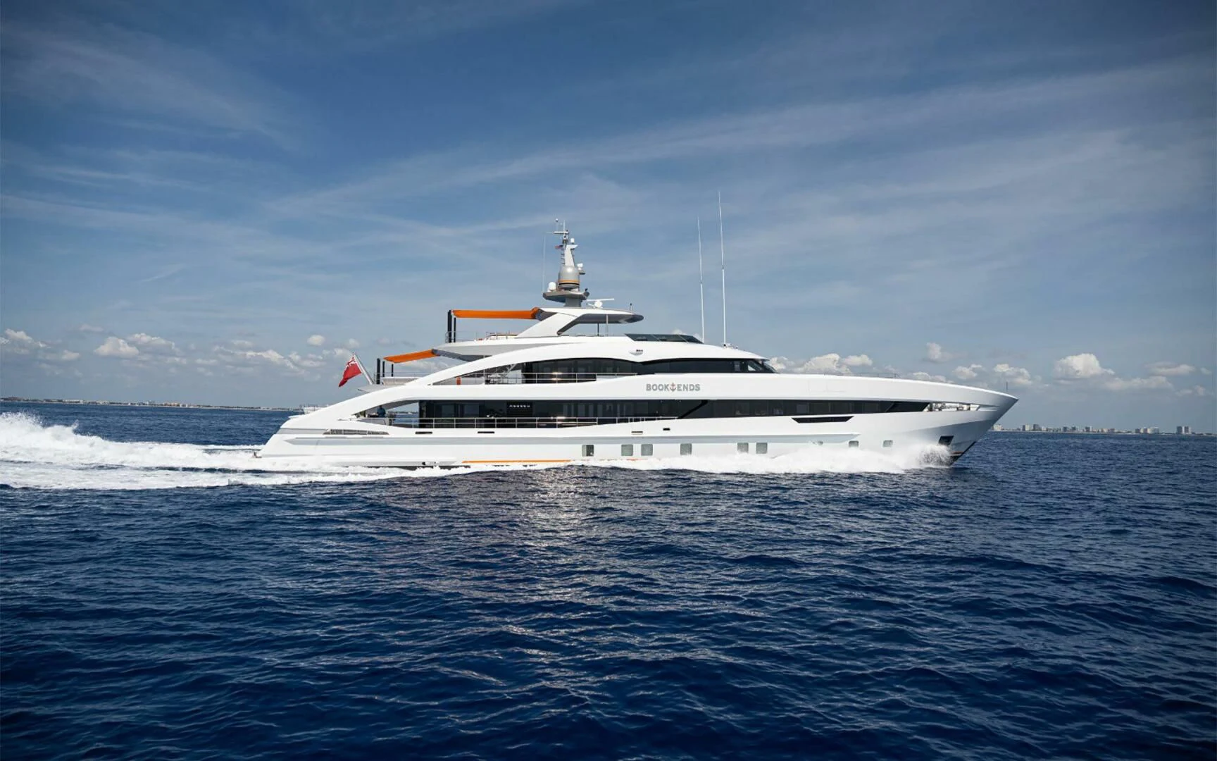 a white yacht in the water aboard INFINITY Yacht for Sale