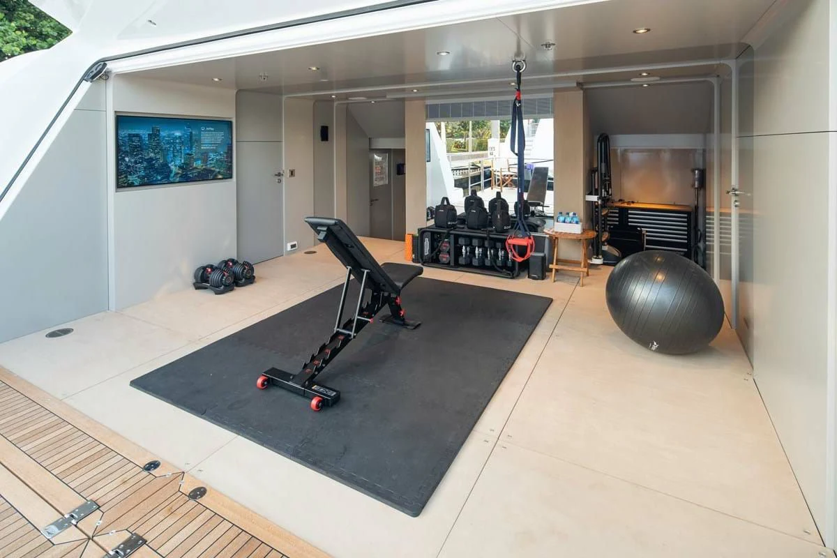 a room with a large ball and a large ball on the floor aboard INFINITY Yacht for Sale