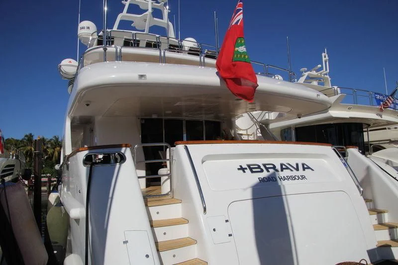 a boat with a flag on the front aboard HEAVEN CAN WAIT Yacht for Charter