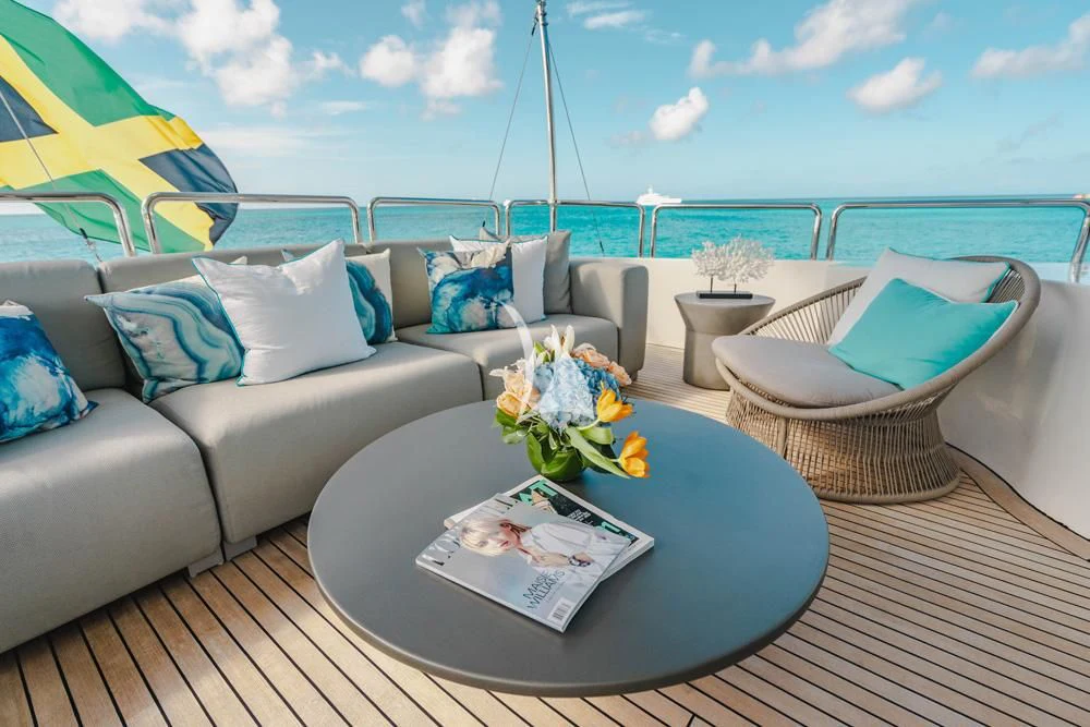 a table with a flower on it aboard HEAVEN CAN WAIT Yacht for Charter