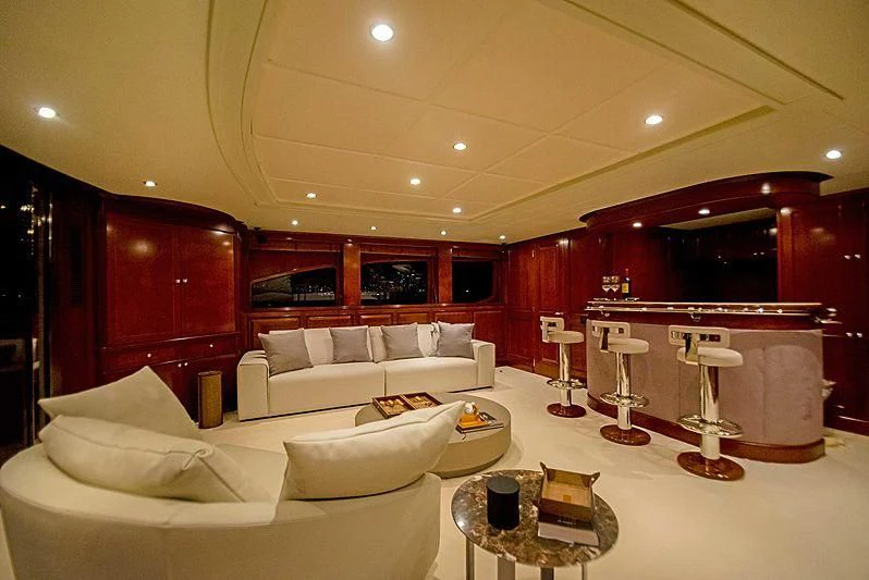 a living room with a white couch and a table aboard HEAVEN CAN WAIT Yacht for Charter