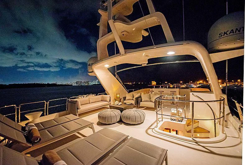 a large white boat on a dock aboard HEAVEN CAN WAIT Yacht for Charter