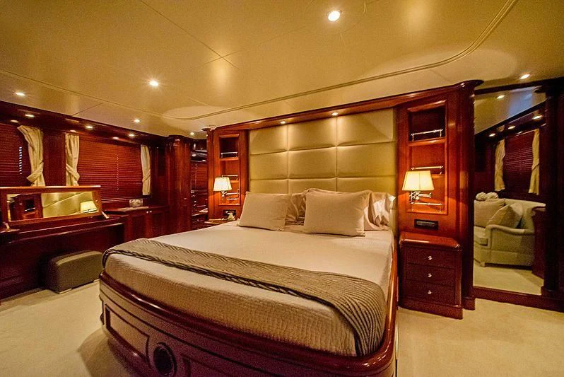 a bedroom with a bed and a desk aboard HEAVEN CAN WAIT Yacht for Charter