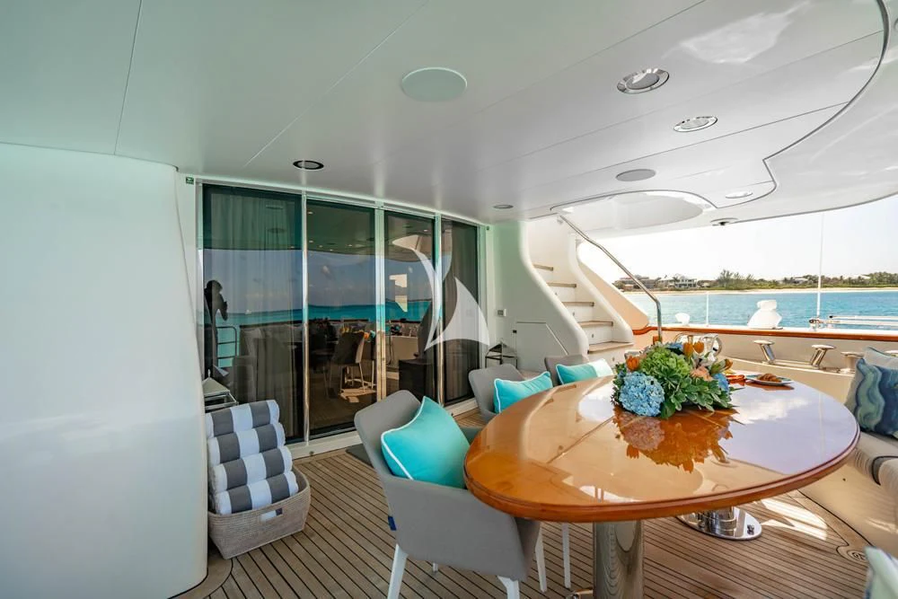 a room with a table and chairs aboard HEAVEN CAN WAIT Yacht for Charter