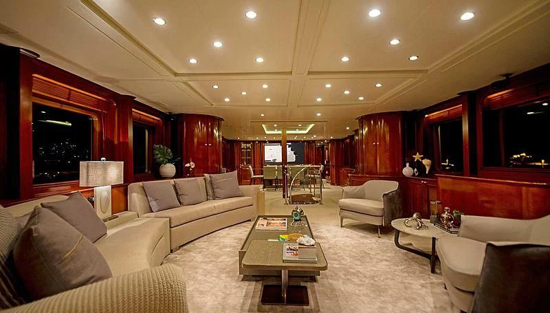a living room with a large mirror aboard HEAVEN CAN WAIT Yacht for Charter