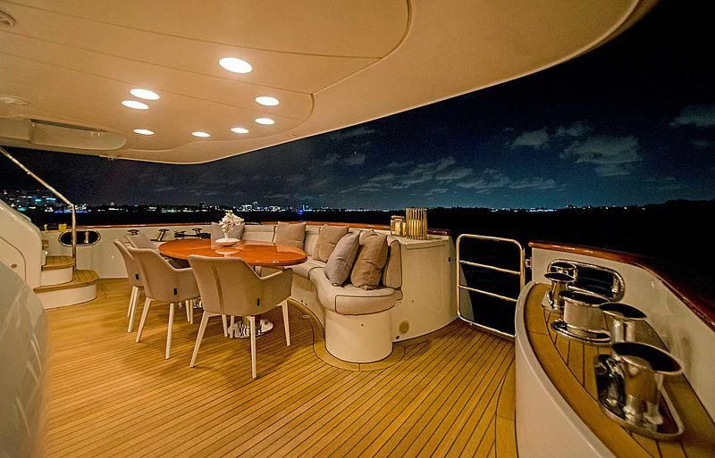 a room with a table and chairs aboard HEAVEN CAN WAIT Yacht for Charter