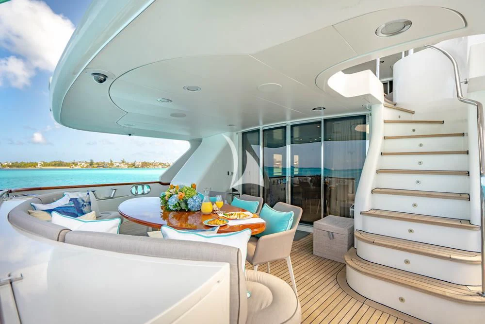 a room with a table and chairs aboard HEAVEN CAN WAIT Yacht for Charter
