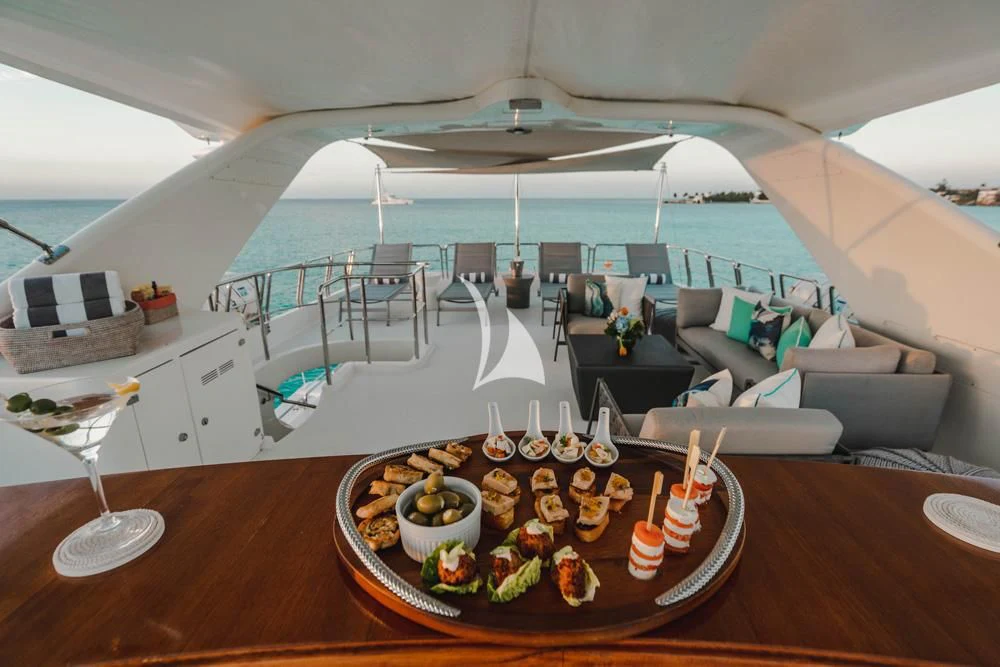 a dining room with a table and chairs aboard HEAVEN CAN WAIT Yacht for Charter