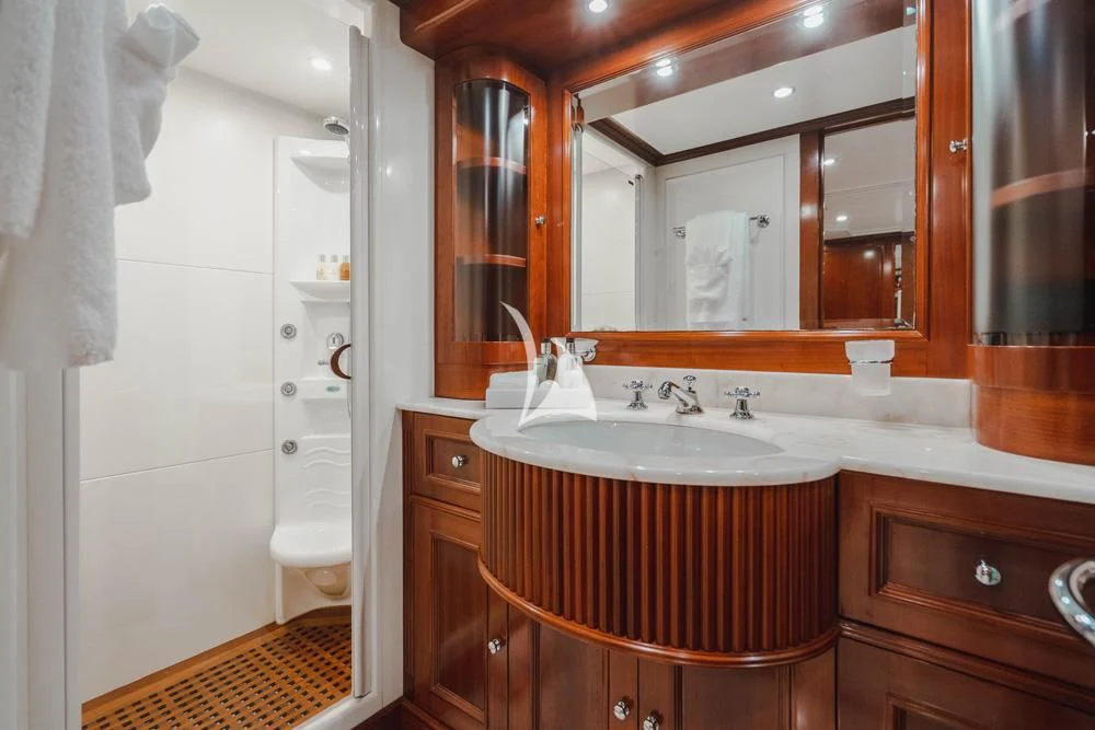 a bathroom with a sink and a mirror aboard HEAVEN CAN WAIT Yacht for Charter