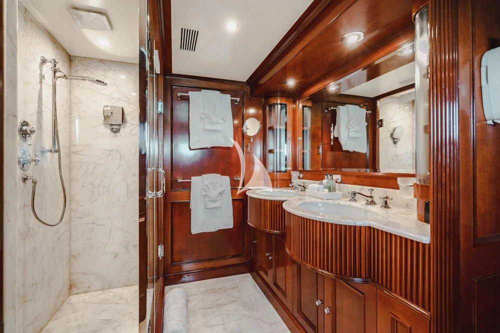 a bathroom with a sink and a mirror aboard HEAVEN CAN WAIT Yacht for Charter