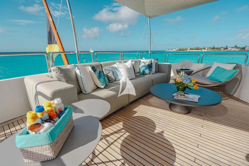 a living room with a couch and a table aboard HEAVEN CAN WAIT Yacht for Charter