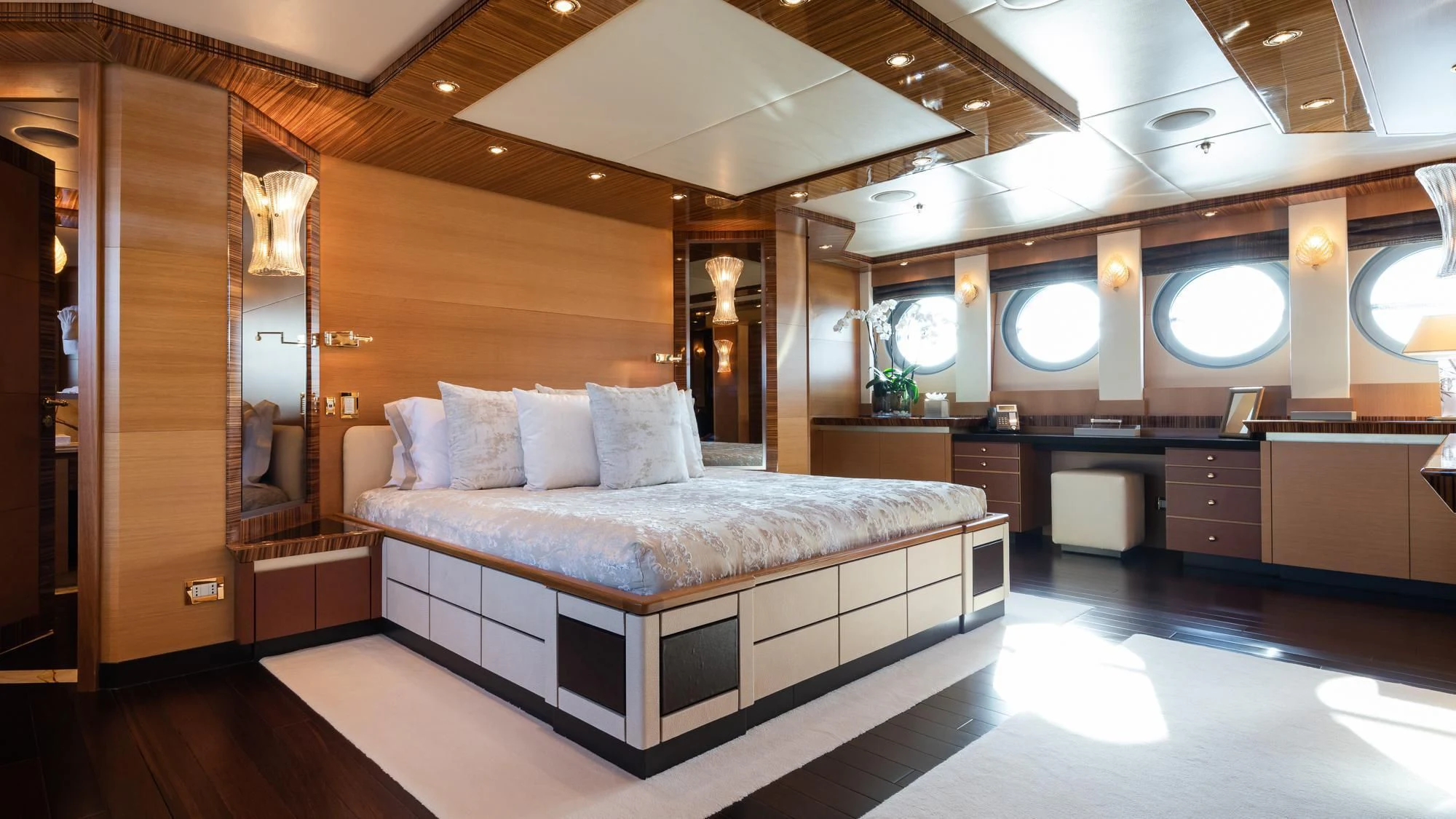 a large bedroom with a large bed aboard HOKULANI Yacht for Sale