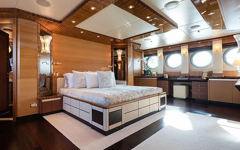 a large bed in a room aboard HOKULANI Yacht for Sale