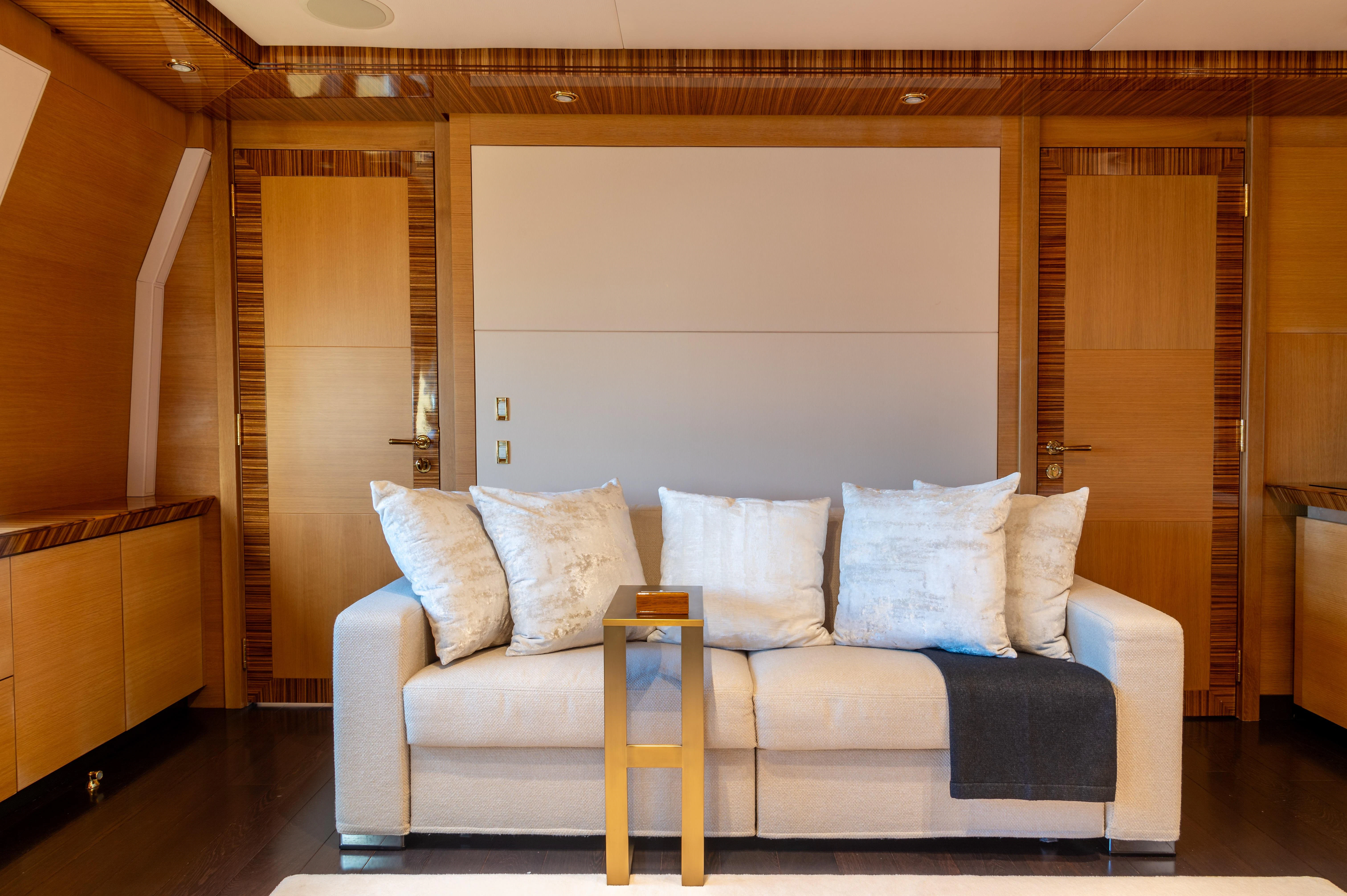 a couch in a room aboard HOKULANI Yacht for Sale