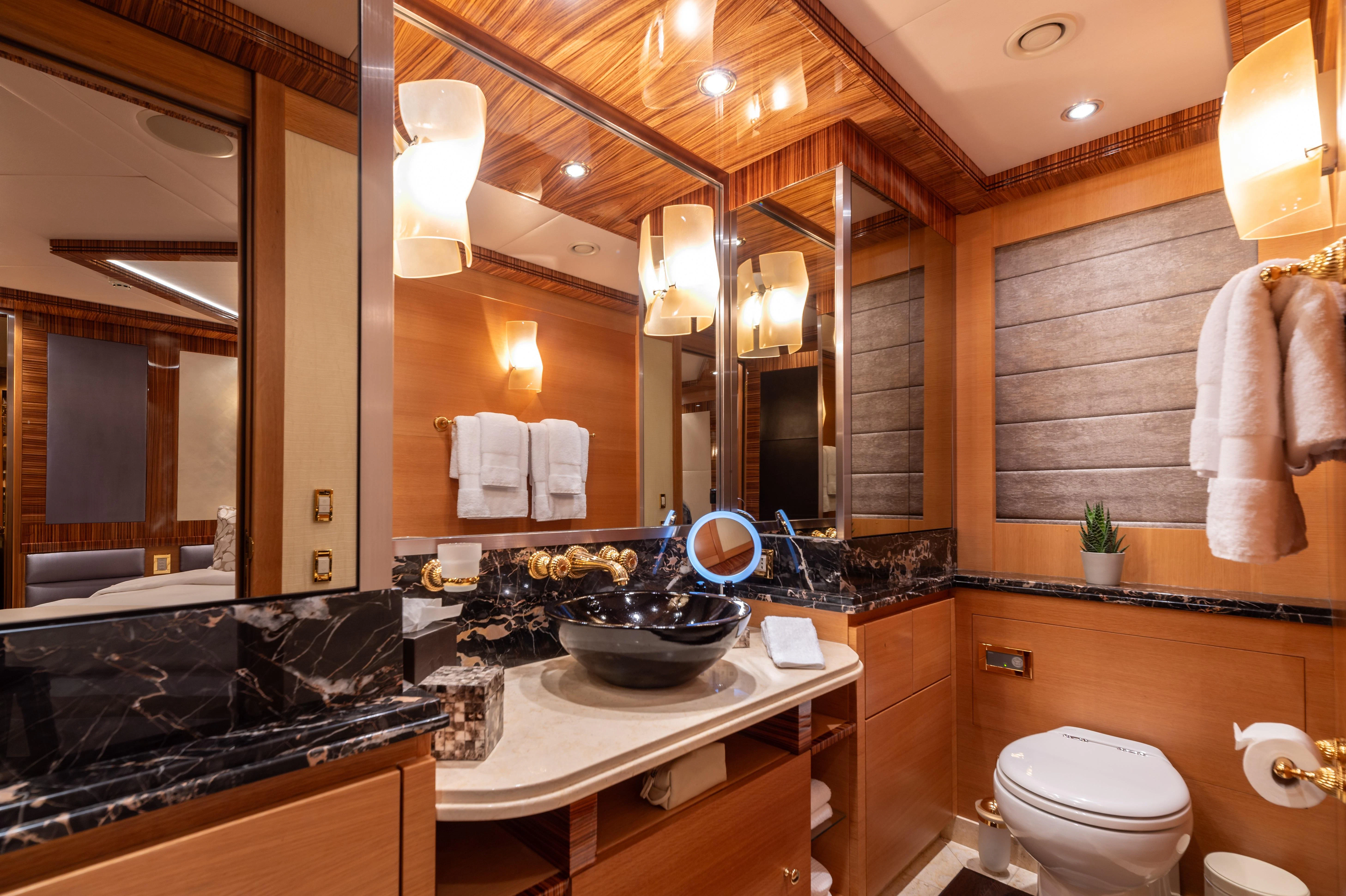 a bathroom with a large mirror aboard HOKULANI Yacht for Sale