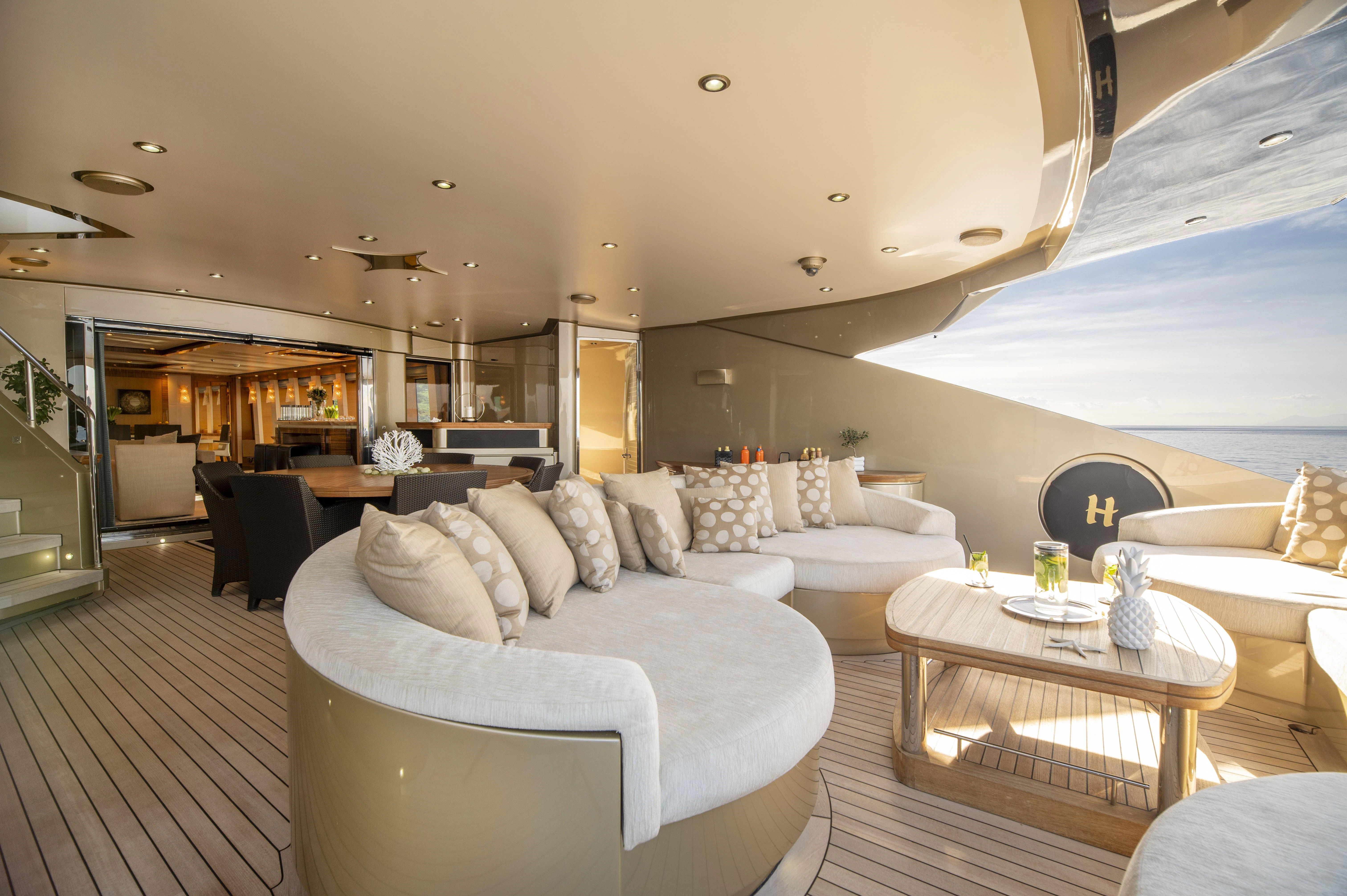 a living room with a couch and a table aboard HOKULANI Yacht for Sale