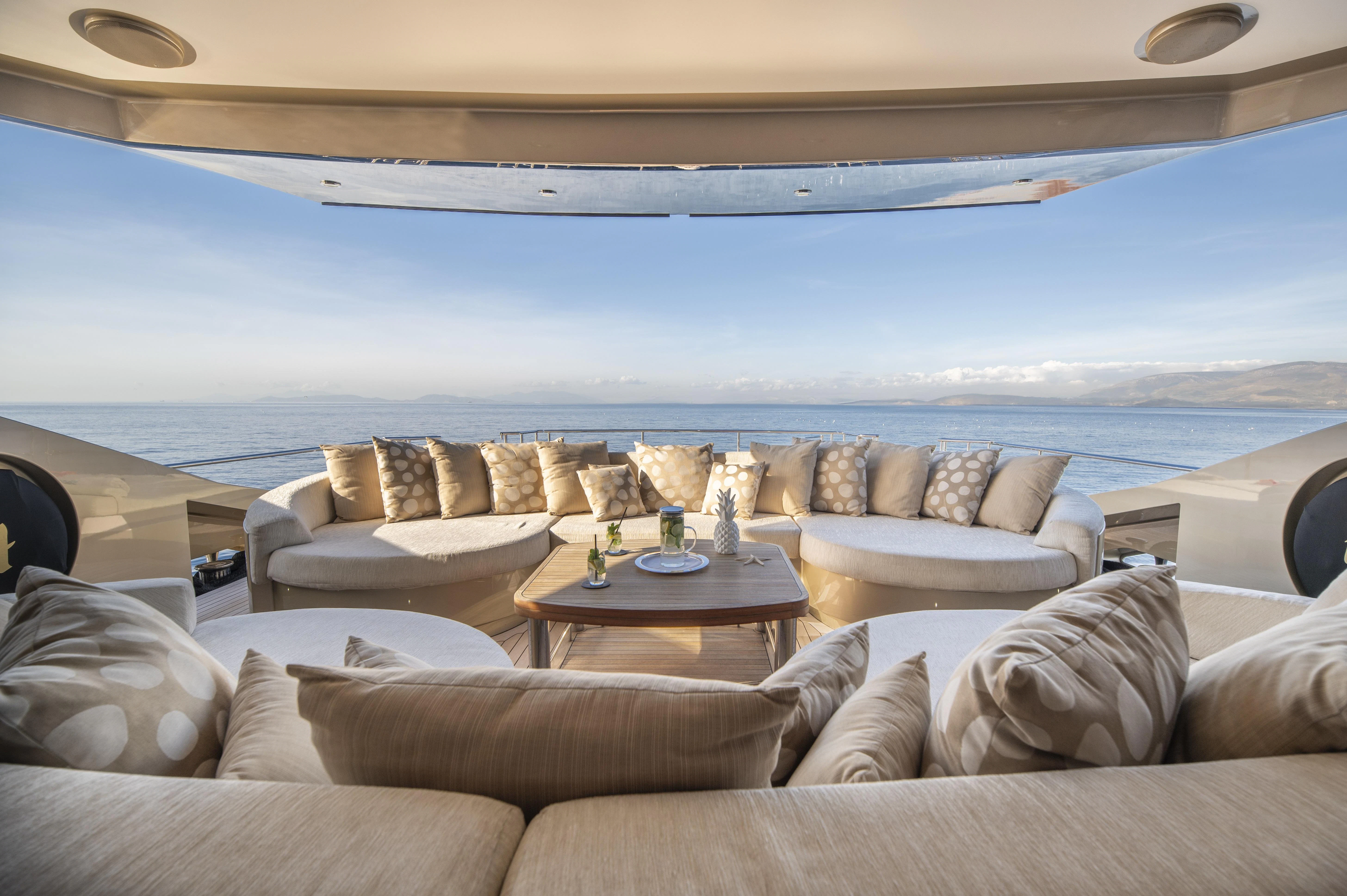 a living room with a large sofa aboard HOKULANI Yacht for Sale