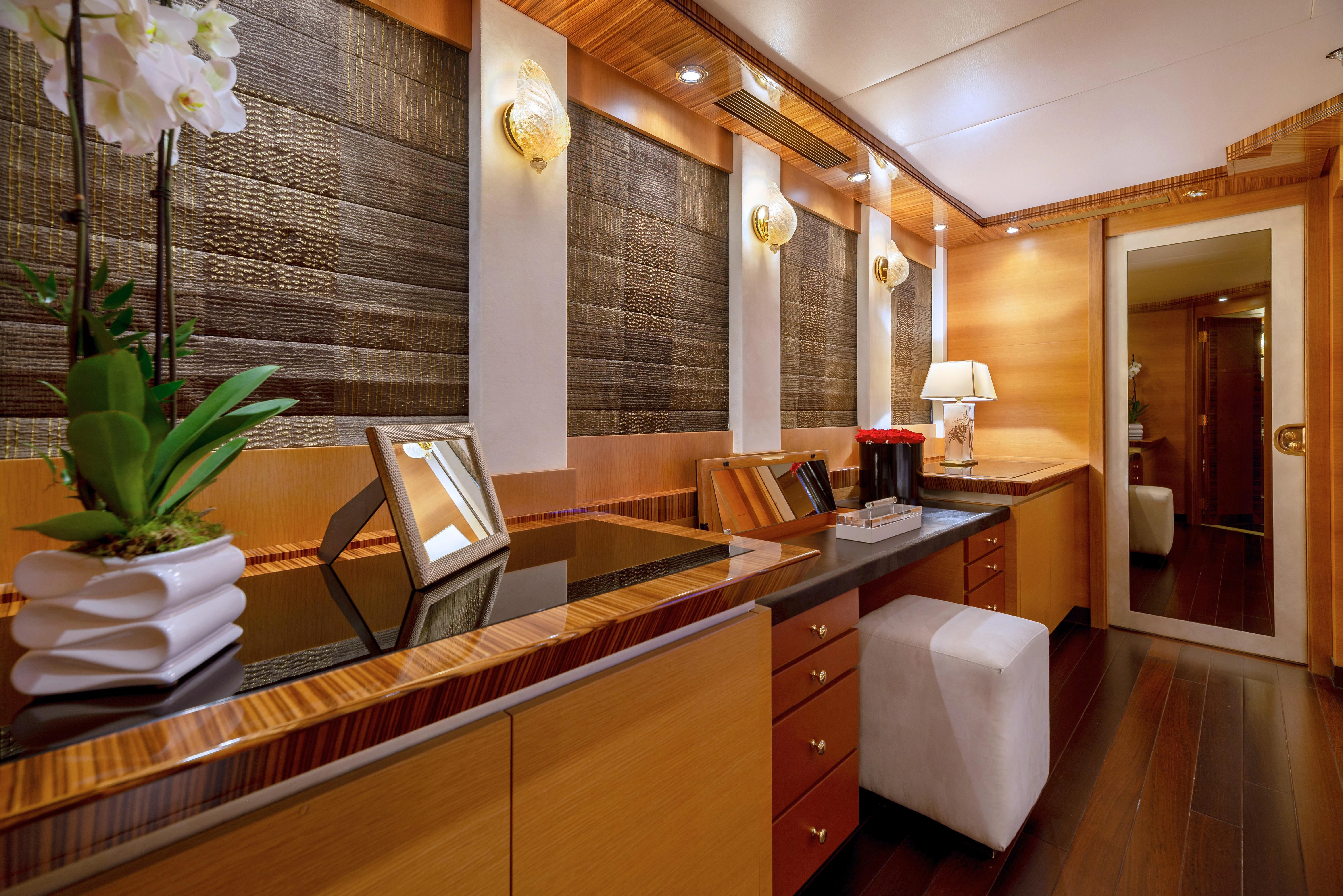 a bathroom with a countertop sink and a mirror aboard HOKULANI Yacht for Sale