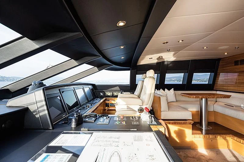 a control room with a table and chairs aboard HOKULANI Yacht for Sale