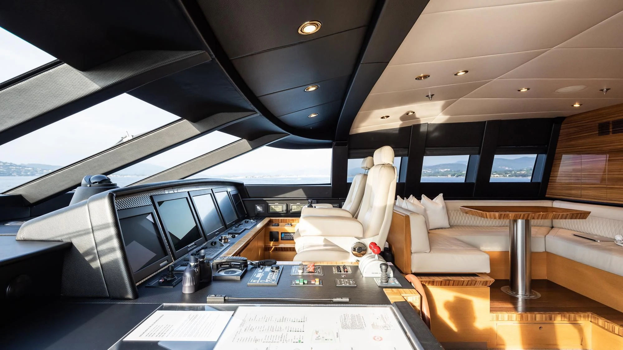 a room with computers and chairs aboard HOKULANI Yacht for Sale