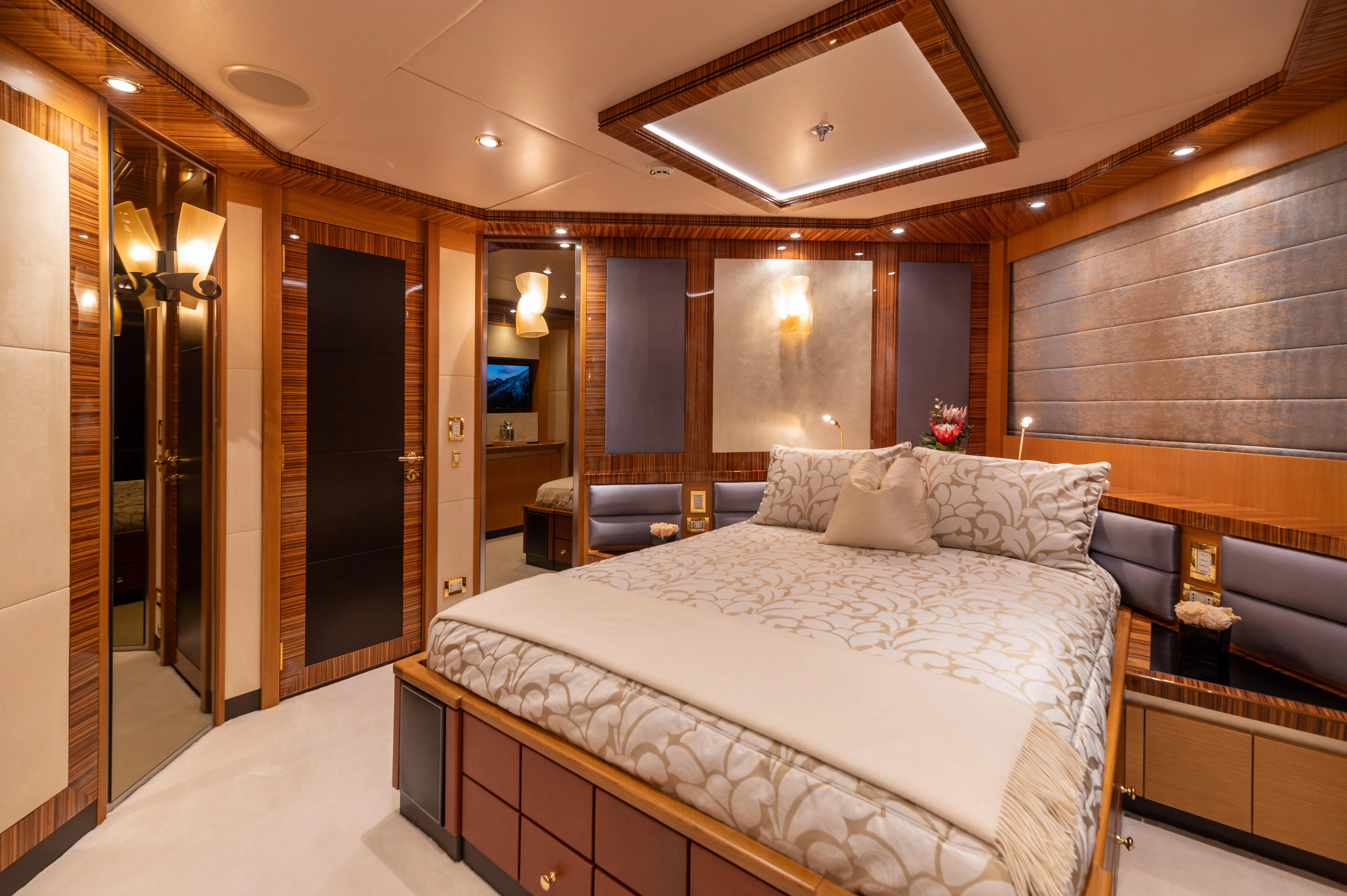 a large bed in a room aboard HOKULANI Yacht for Sale
