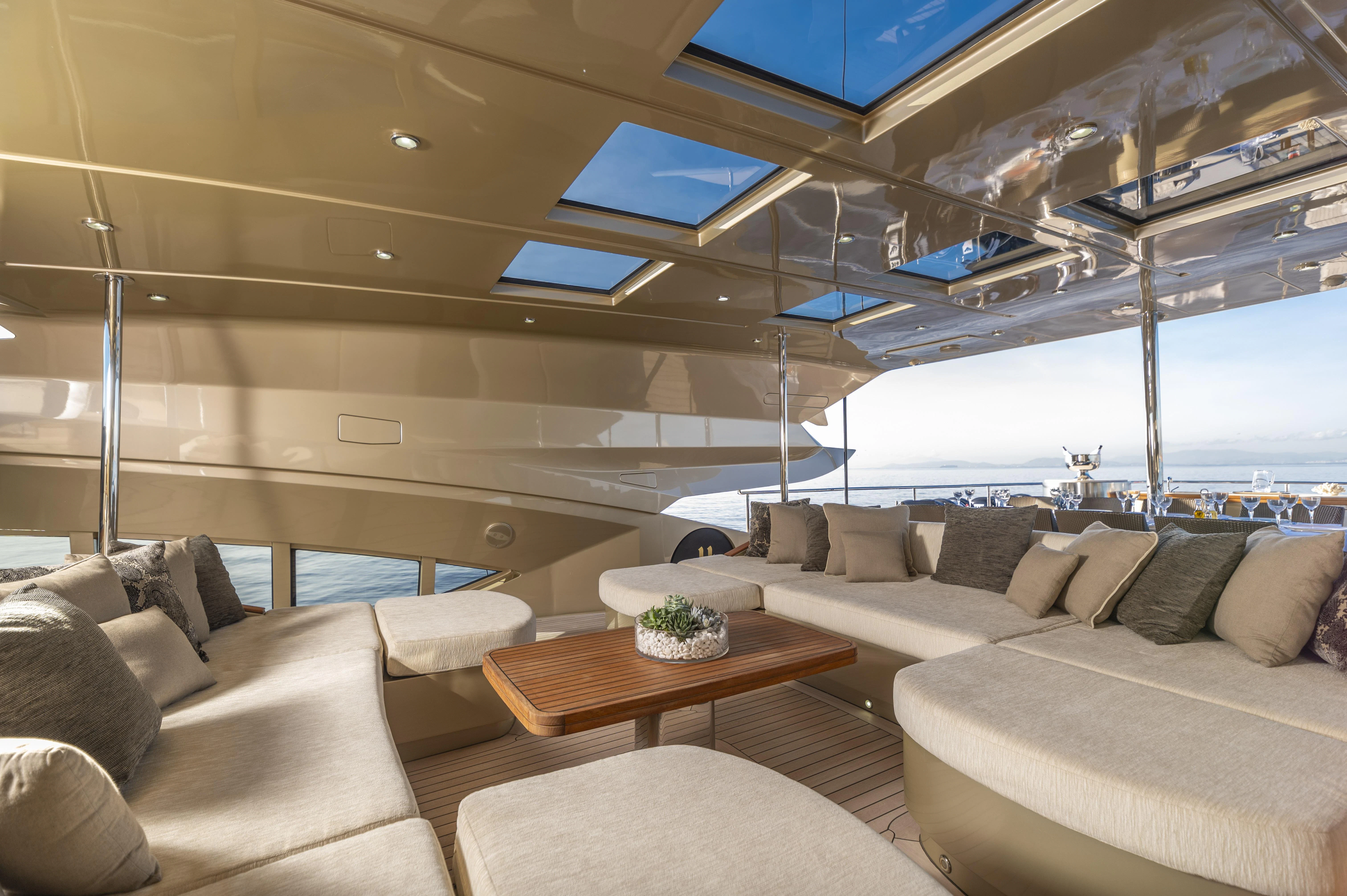a room with couches and a table aboard HOKULANI Yacht for Sale