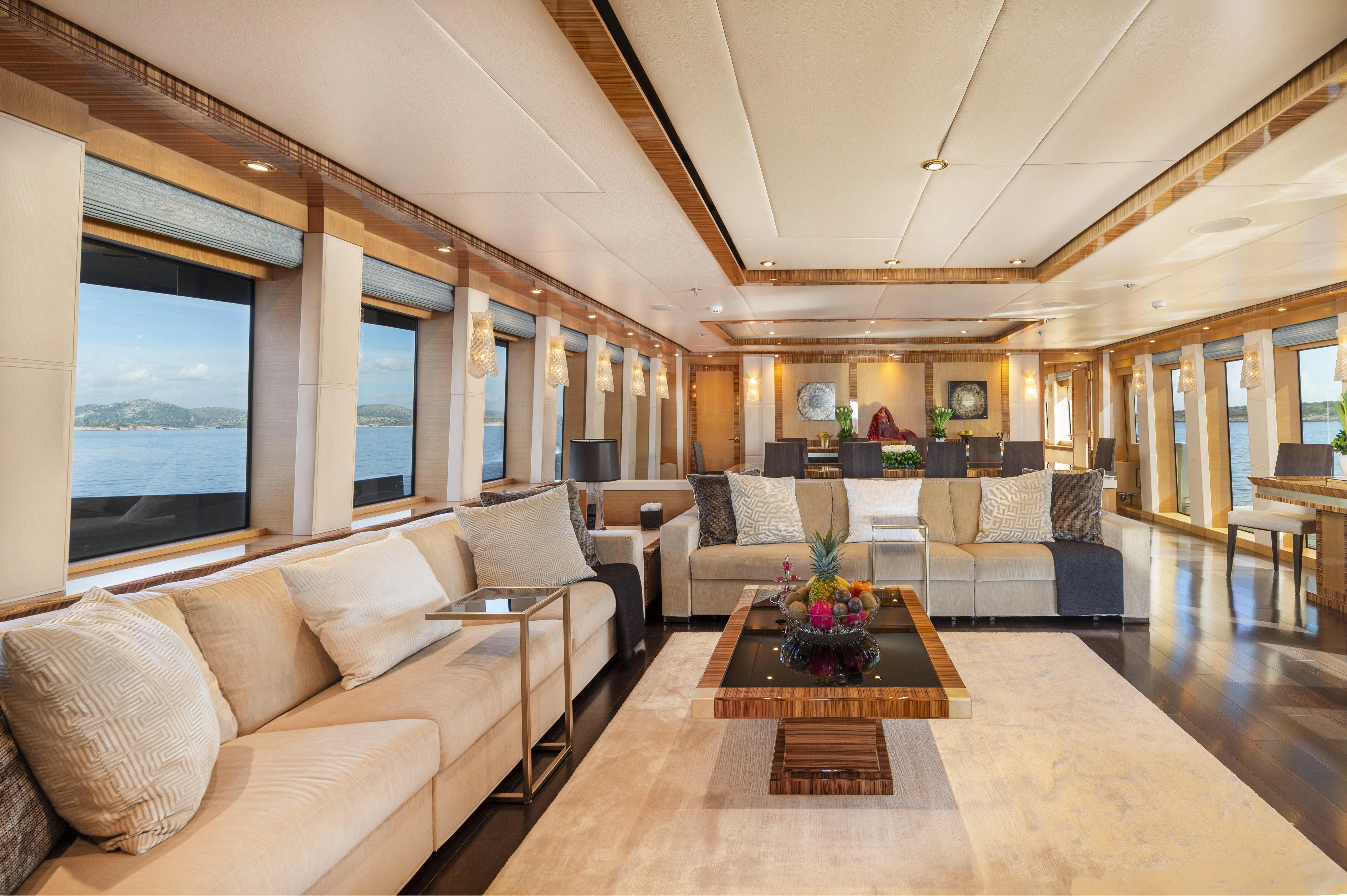 a living room with a large window aboard HOKULANI Yacht for Sale
