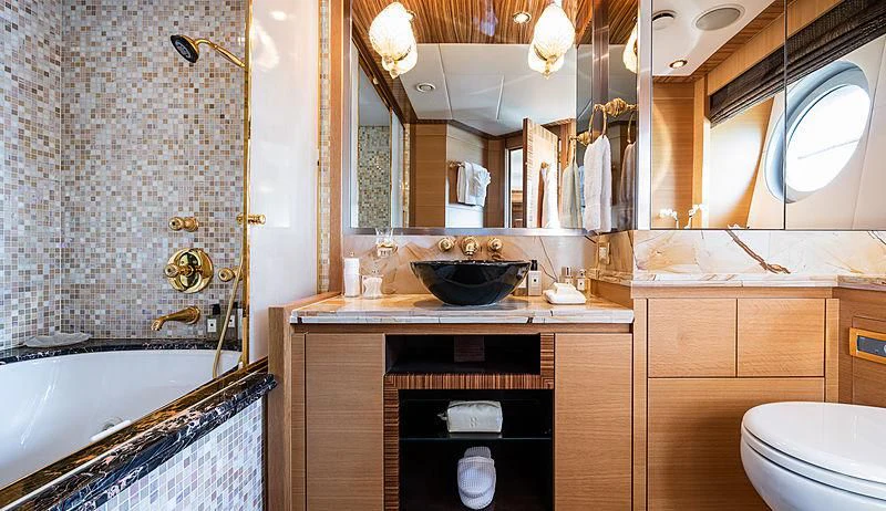 a bathroom with a sink and a toilet aboard HOKULANI Yacht for Sale