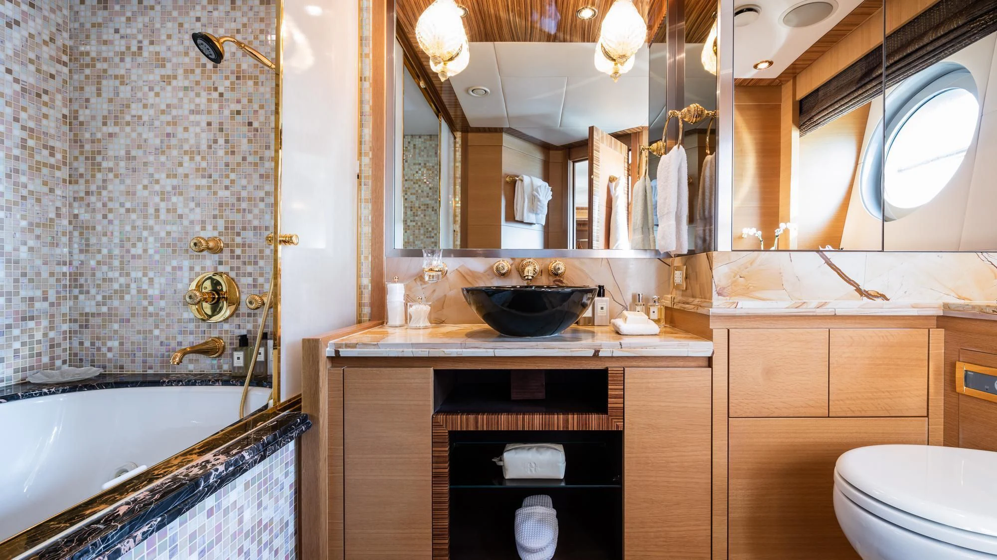 a bathroom with a sink and a toilet aboard HOKULANI Yacht for Sale