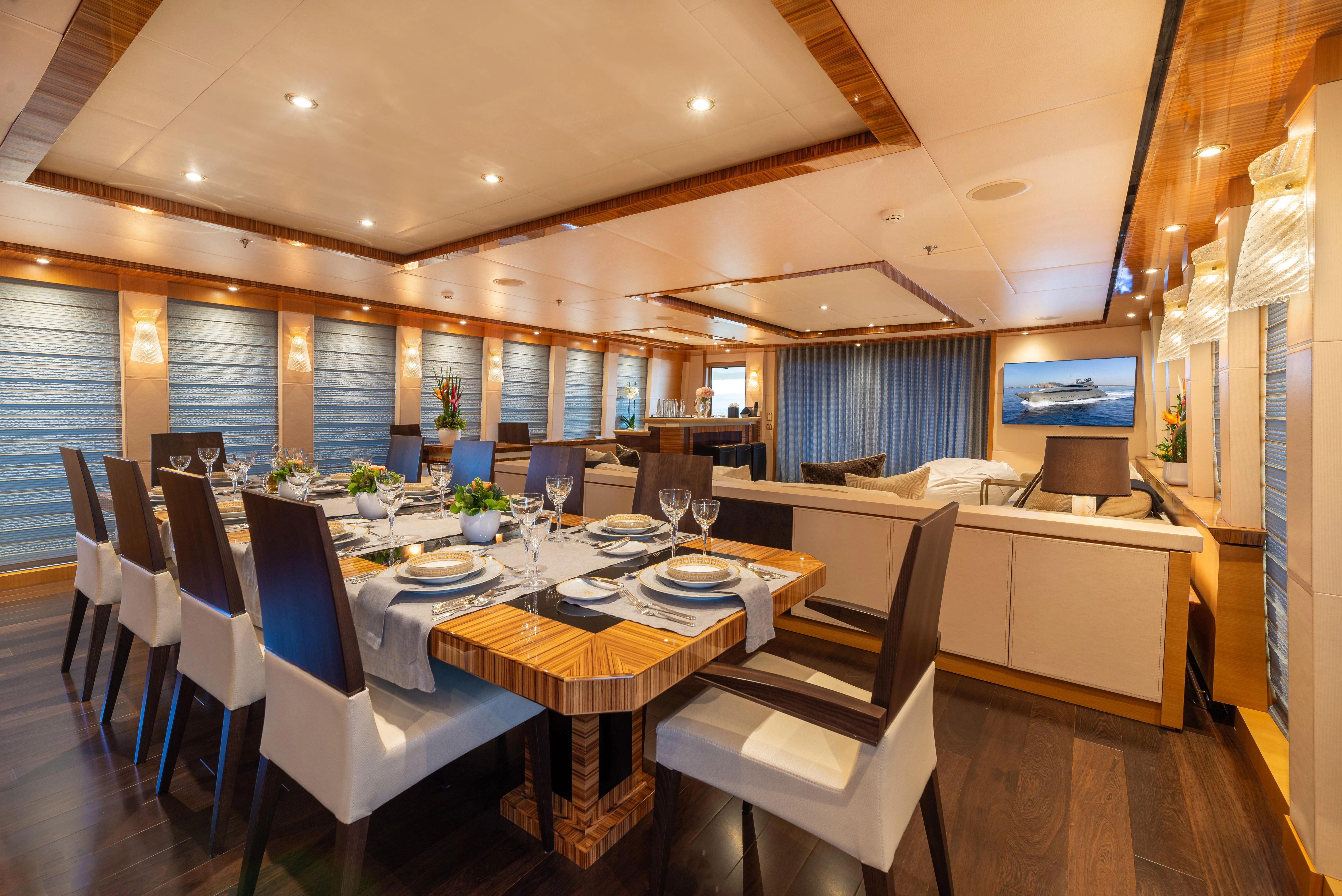a dining room with a table and chairs aboard HOKULANI Yacht for Sale