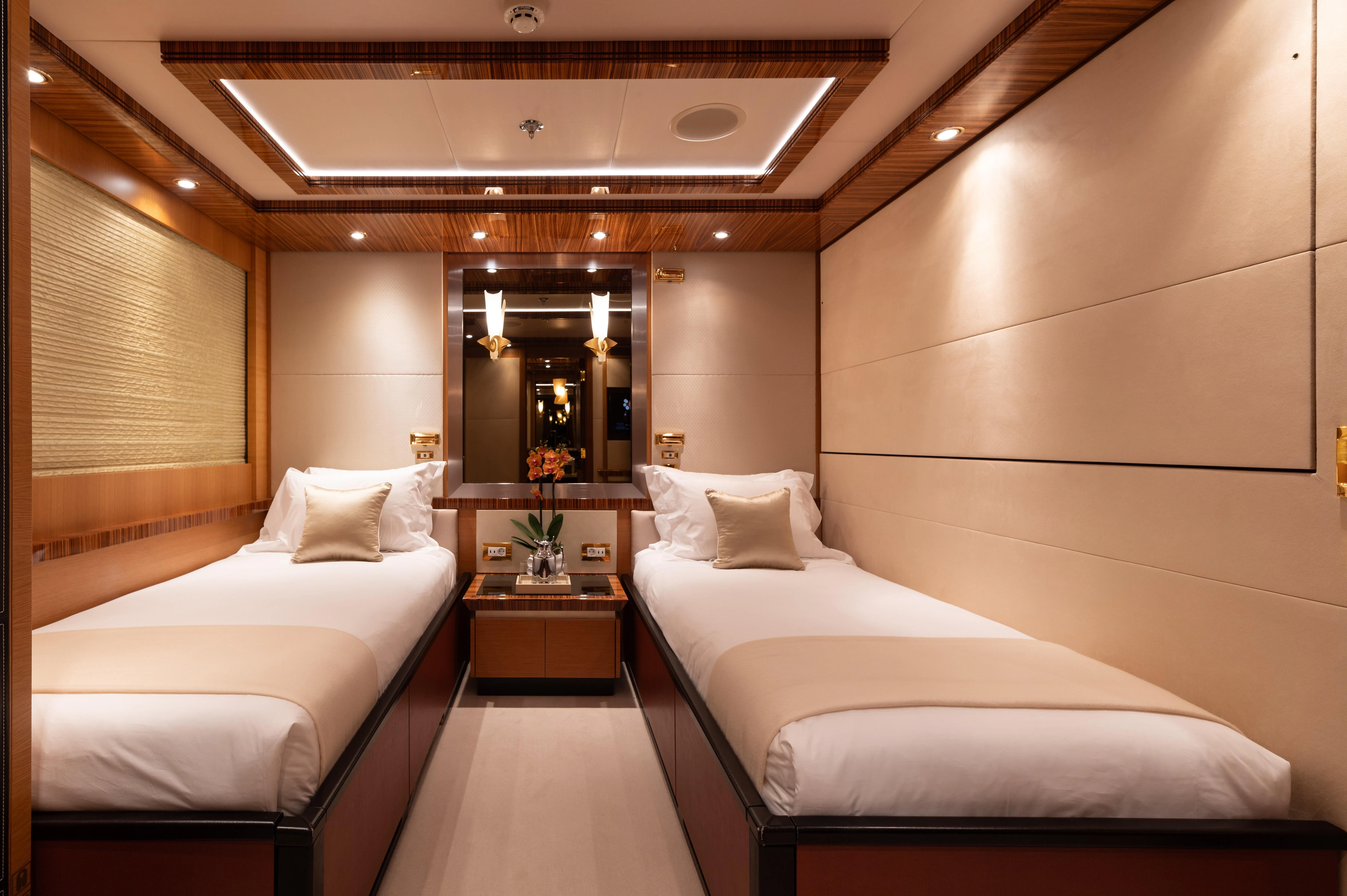 a room with two beds aboard HOKULANI Yacht for Sale