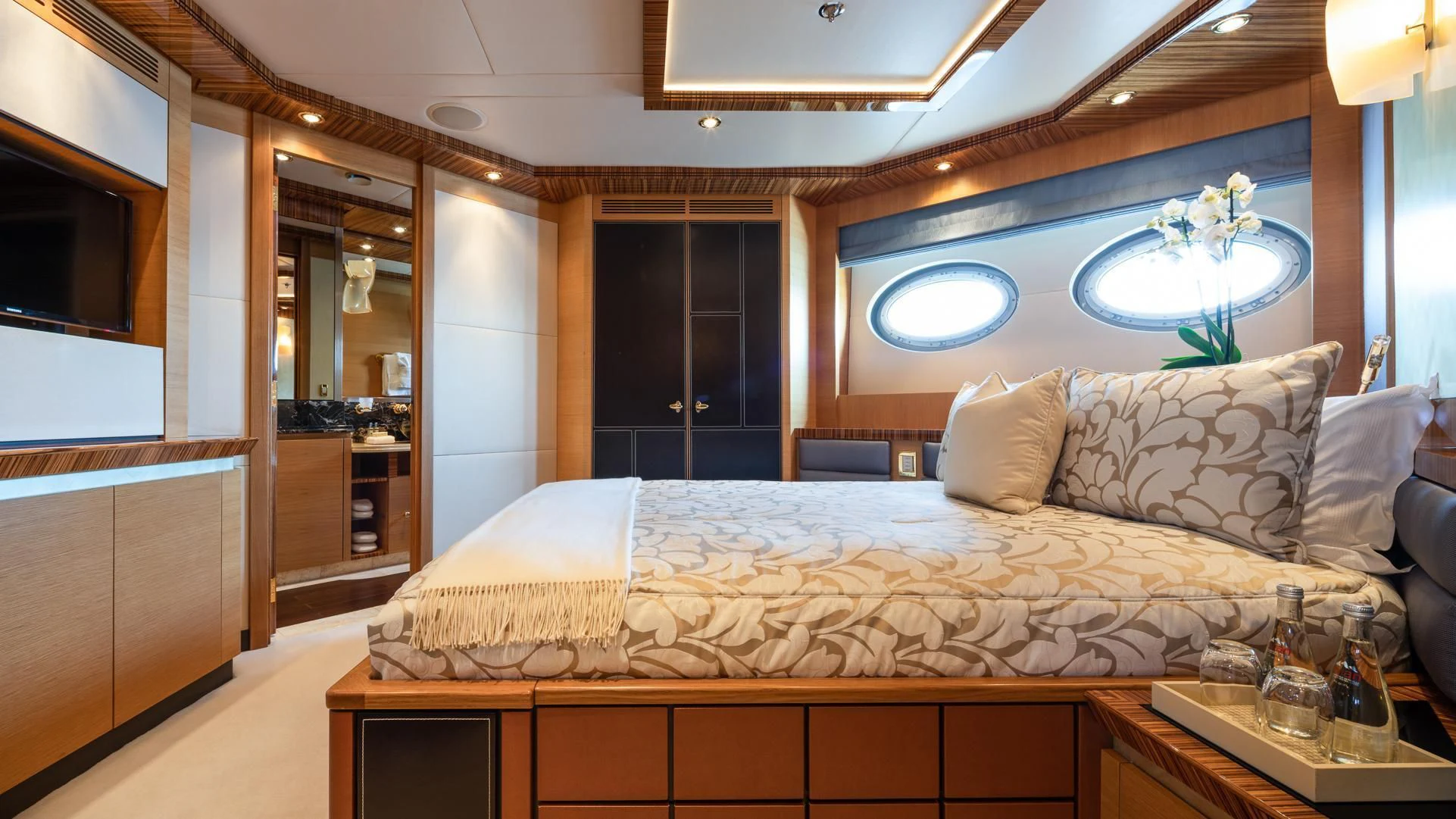 a large bed in a room aboard HOKULANI Yacht for Sale