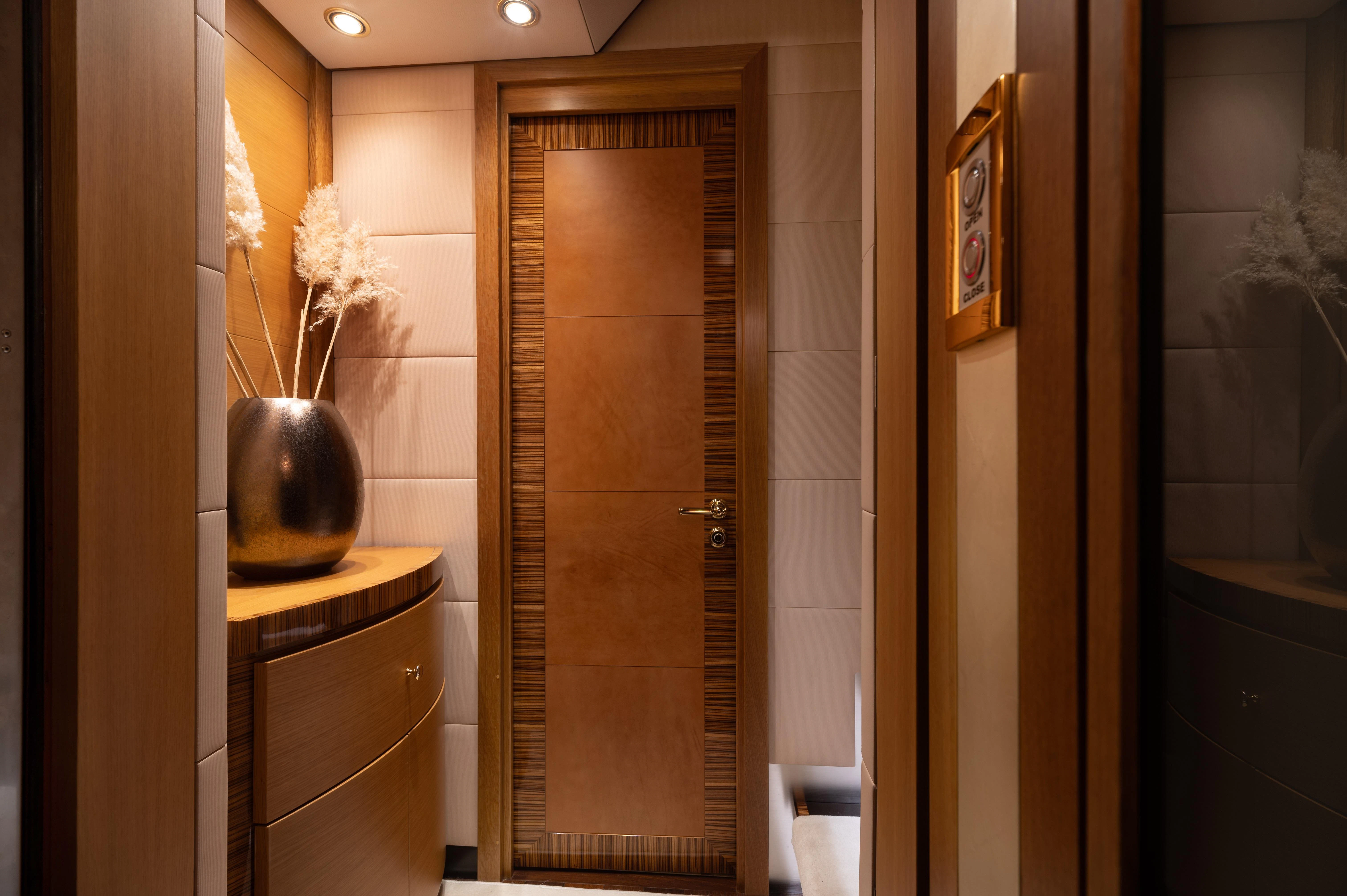 a bathroom with a glass door aboard HOKULANI Yacht for Sale