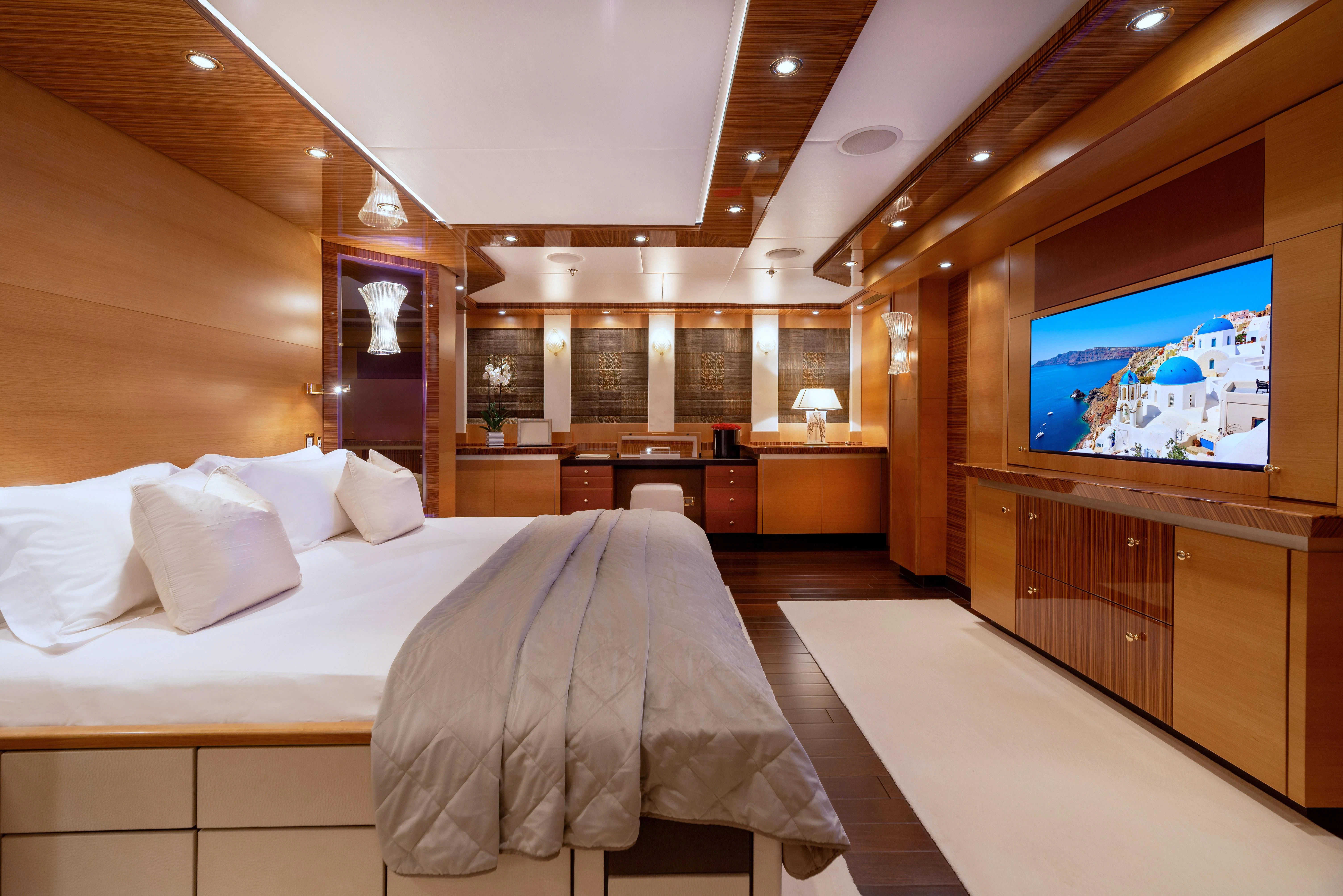 a large hotel room with a large tv aboard HOKULANI Yacht for Sale