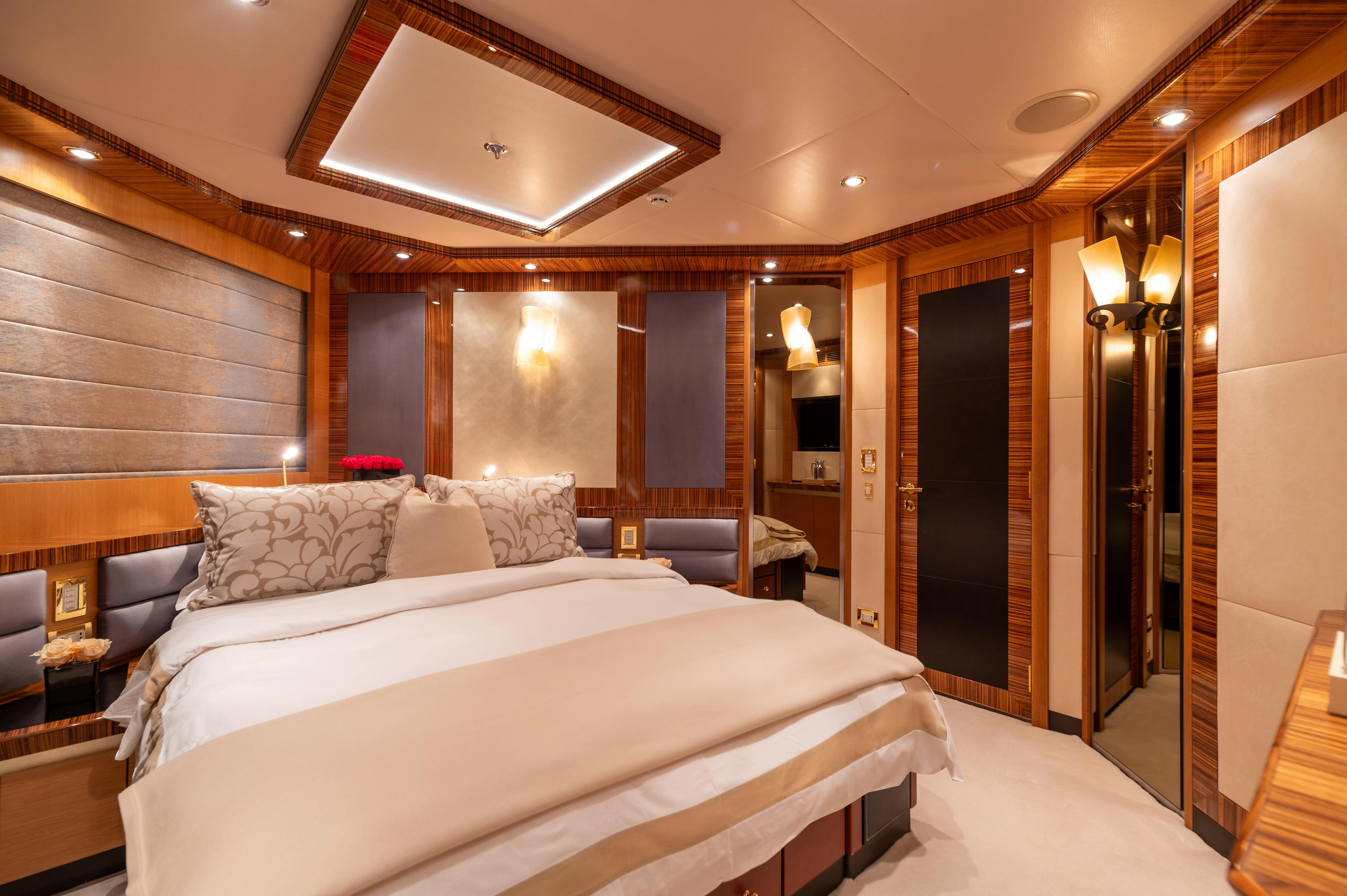 a large hotel room with a large bed aboard HOKULANI Yacht for Sale