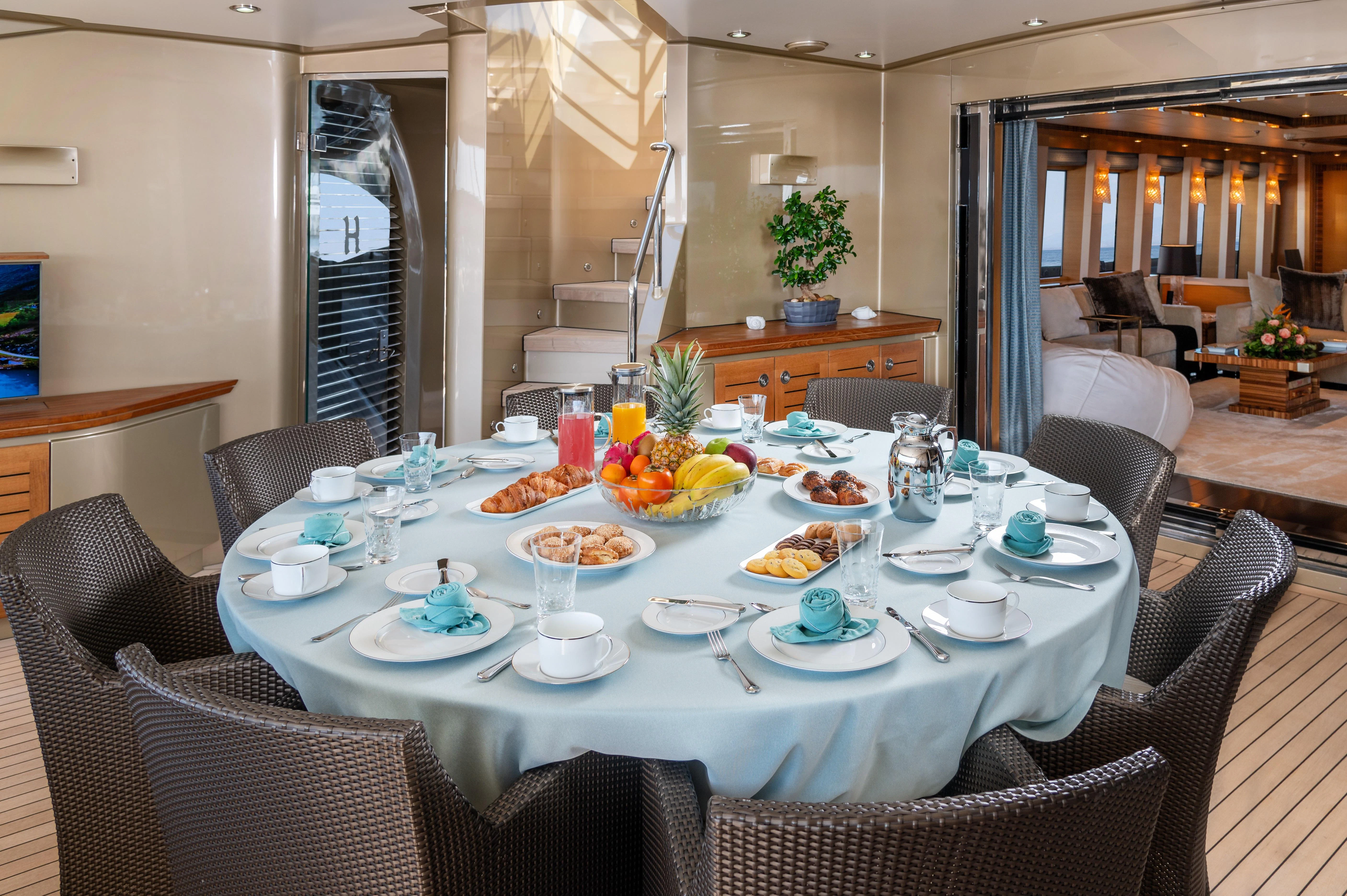 a table with food on it aboard HOKULANI Yacht for Sale