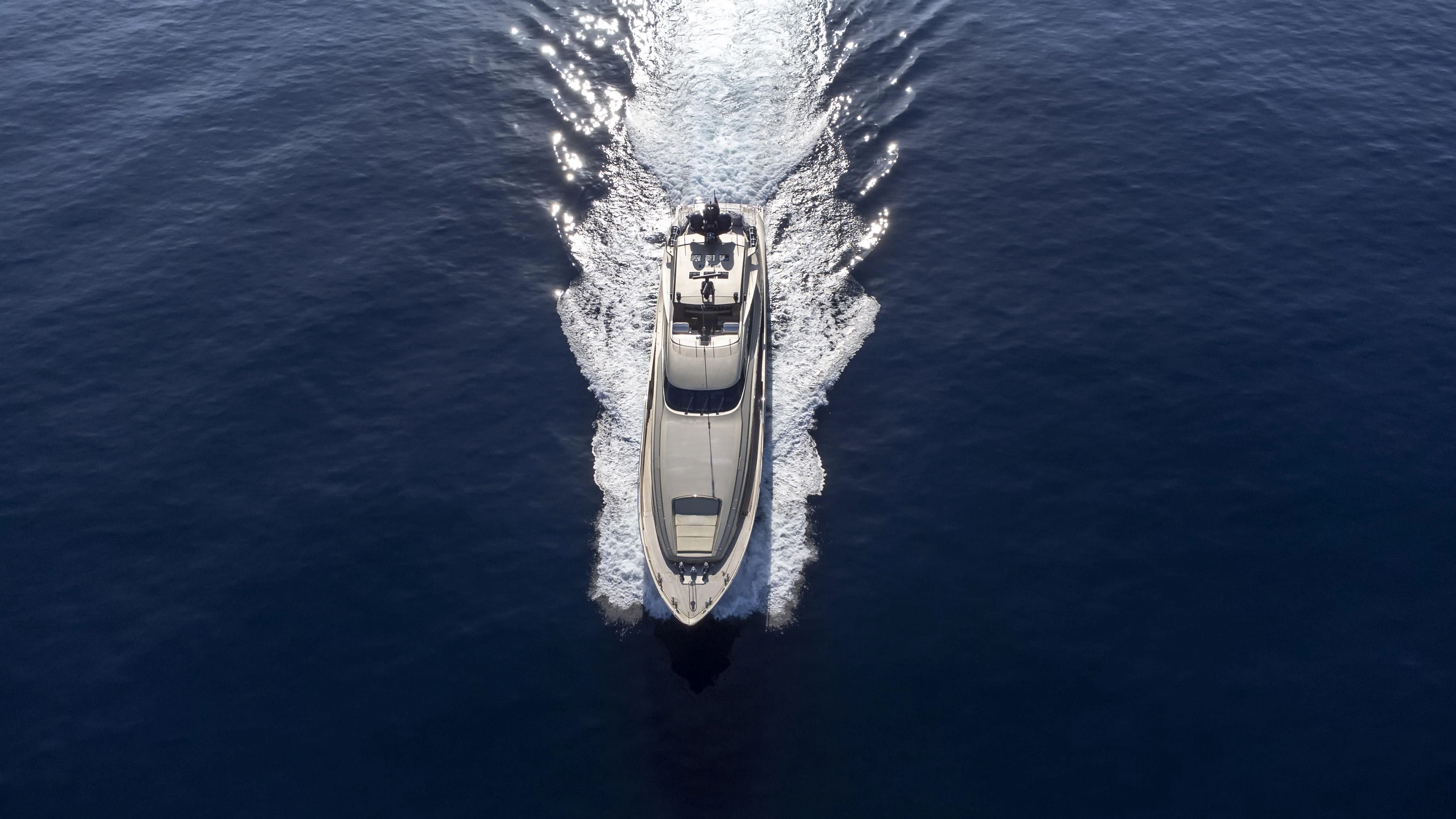 a white and black ship in the water aboard HOKULANI Yacht for Sale
