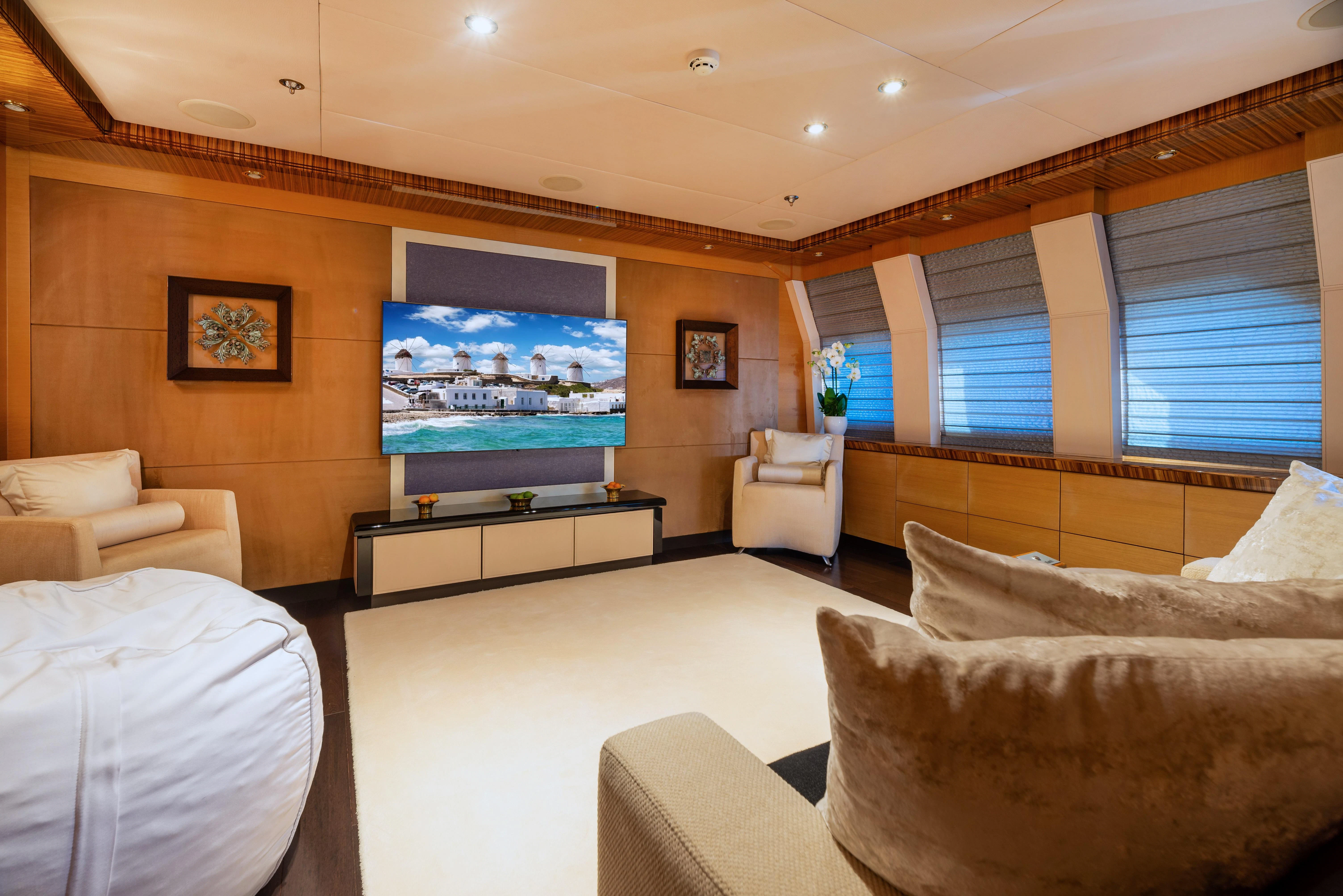 a large bedroom with a large screen aboard HOKULANI Yacht for Sale