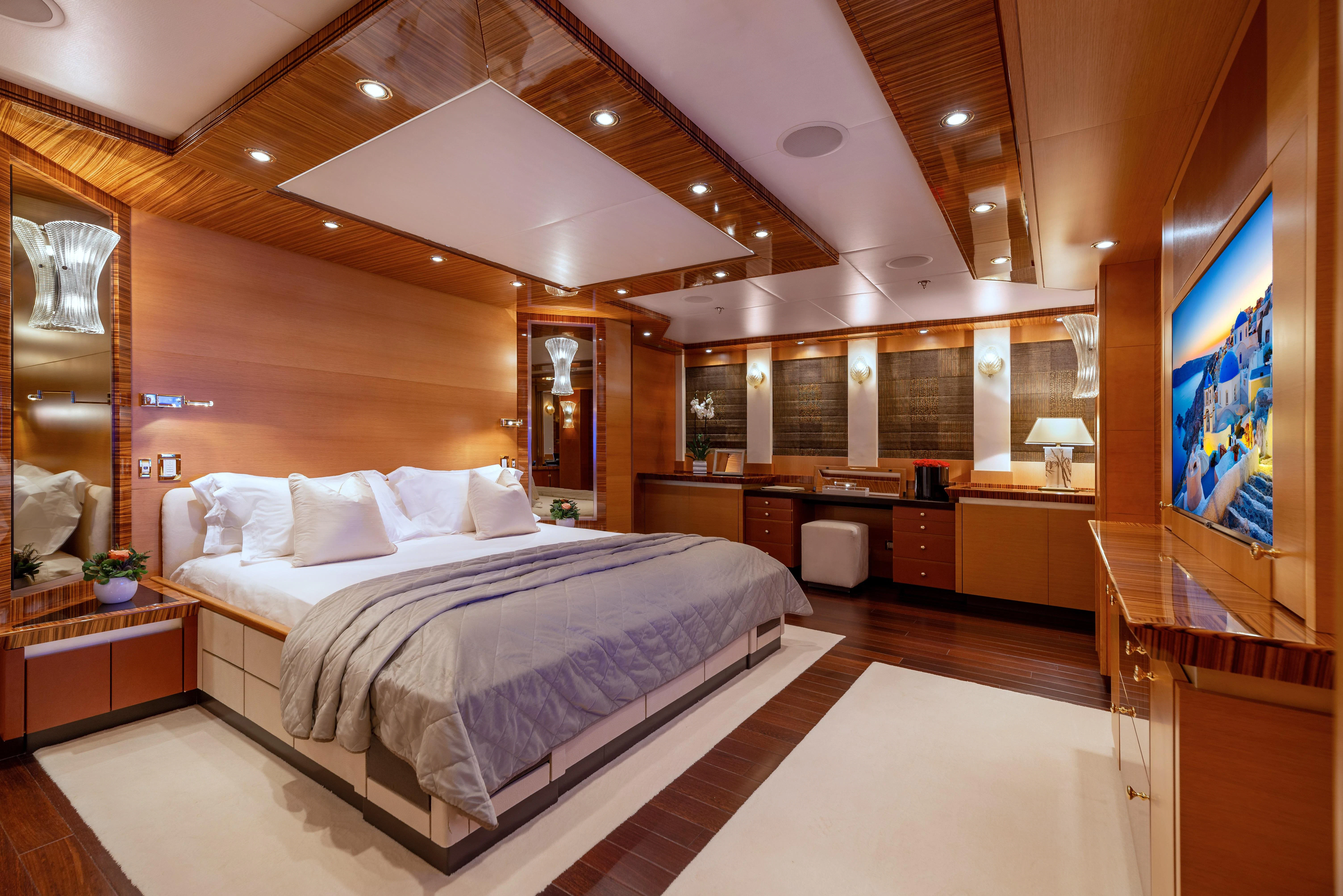 a large bedroom with a large bed aboard HOKULANI Yacht for Sale