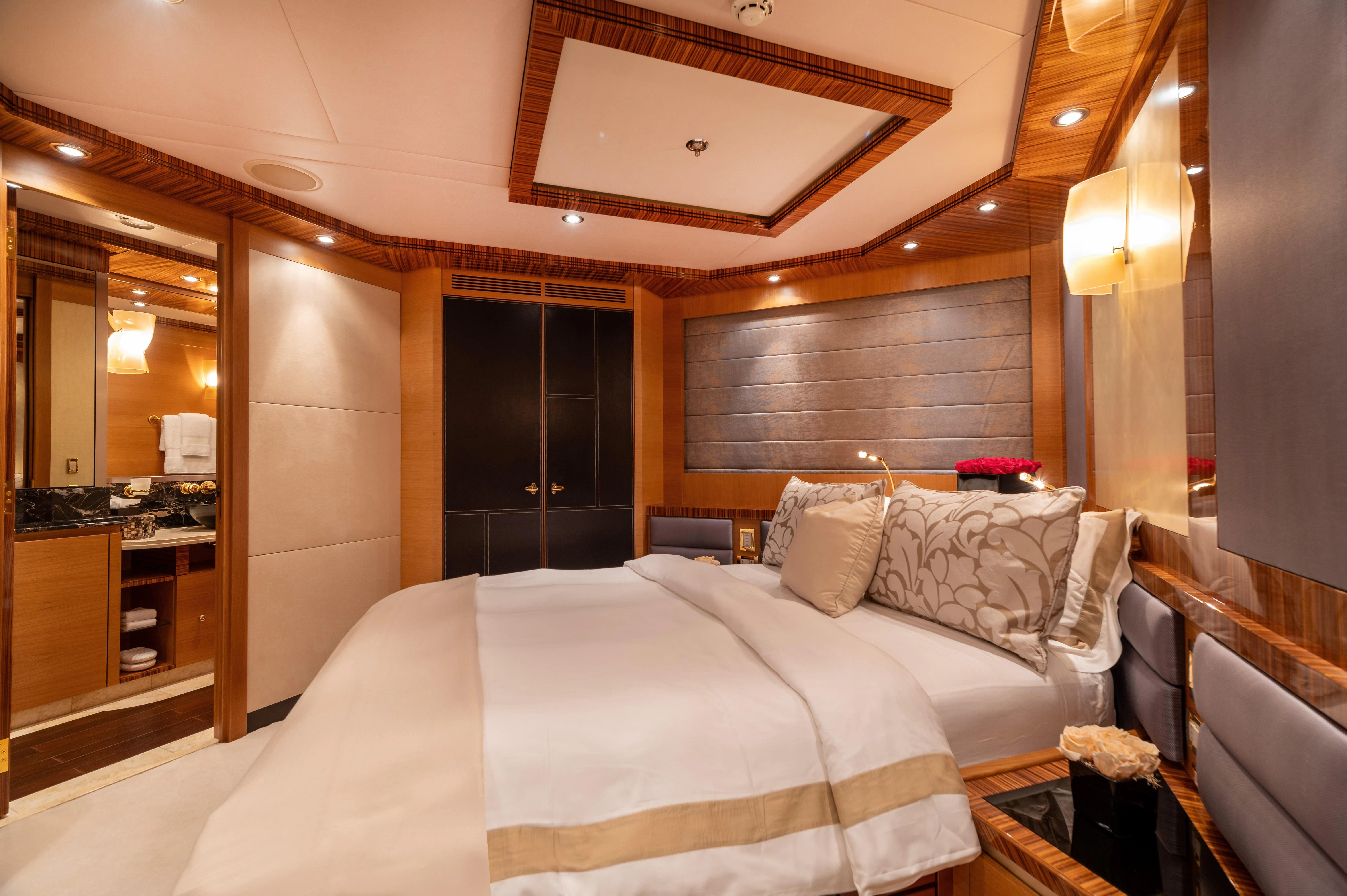 a hotel room with a bed aboard HOKULANI Yacht for Sale