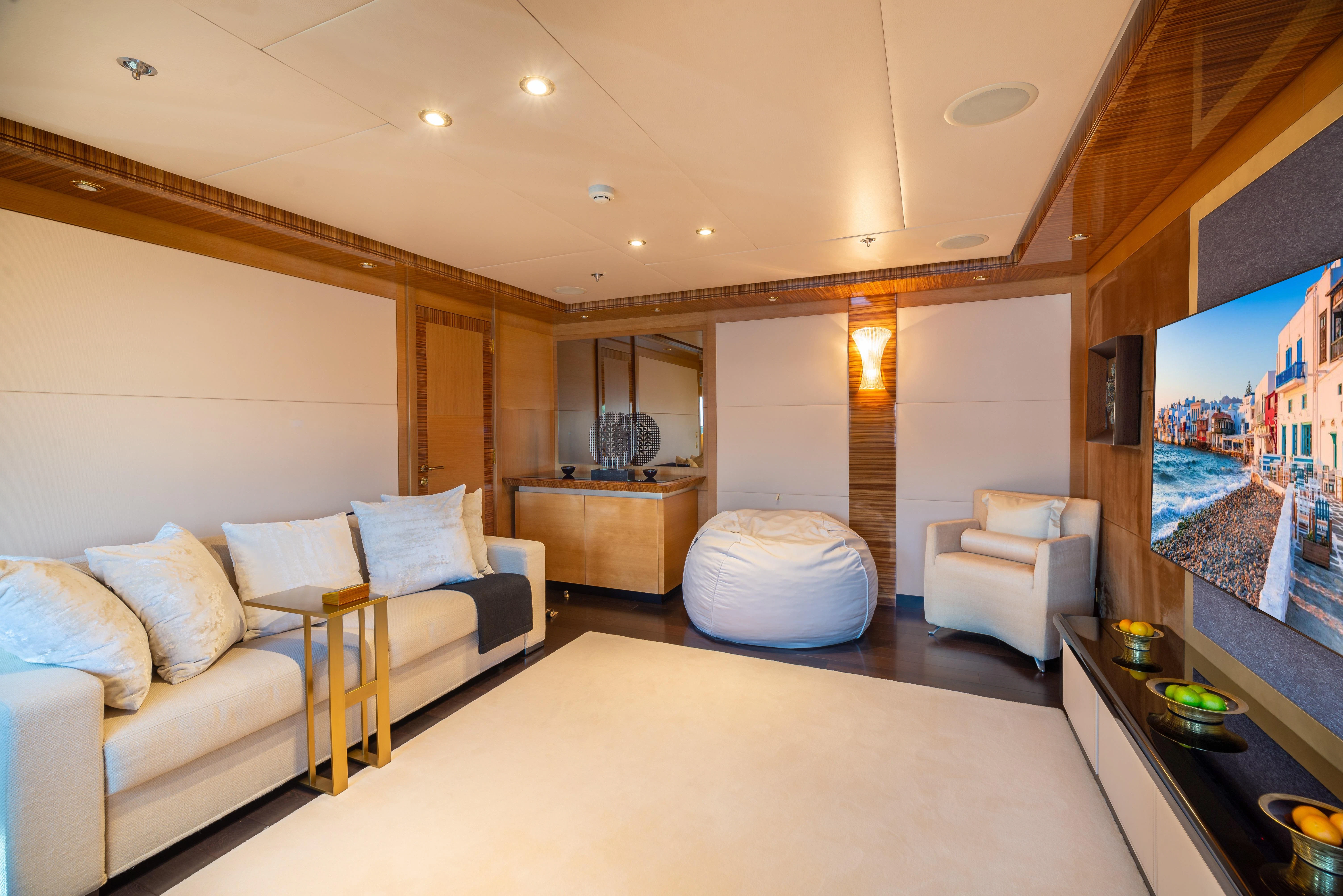 a living room with a large window aboard HOKULANI Yacht for Sale