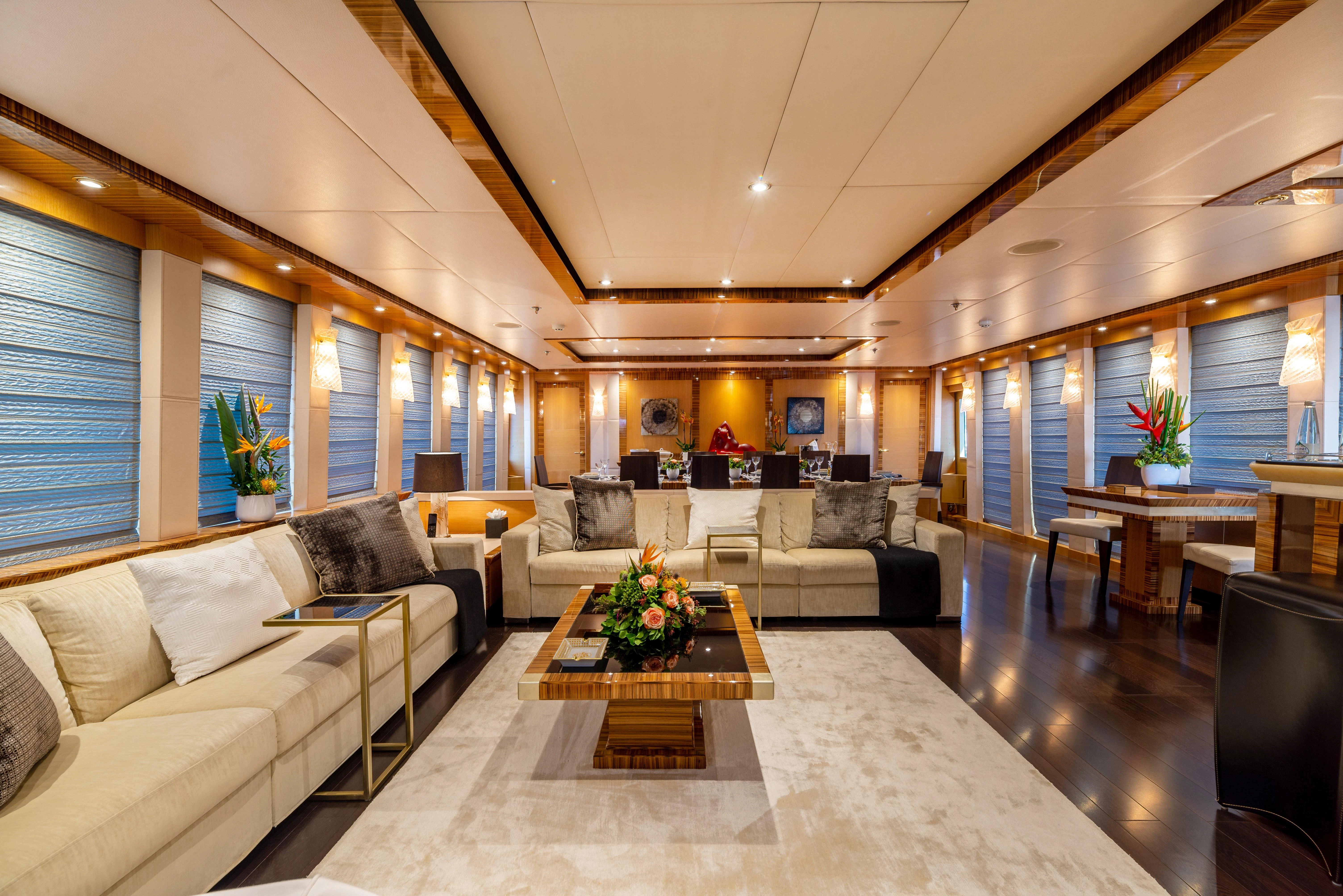 a living room with a large open floor plan aboard HOKULANI Yacht for Sale