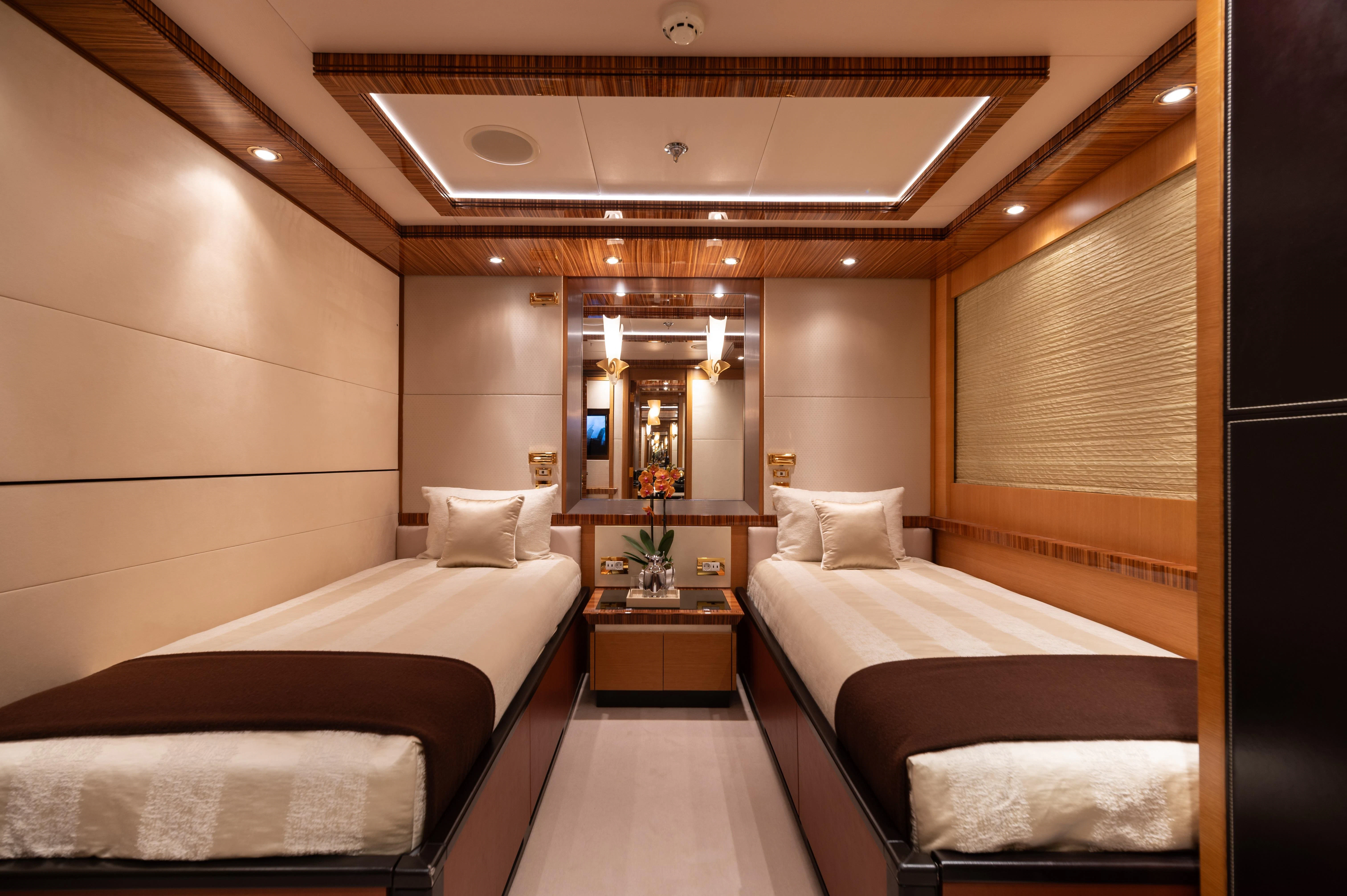 a room with two beds aboard HOKULANI Yacht for Sale