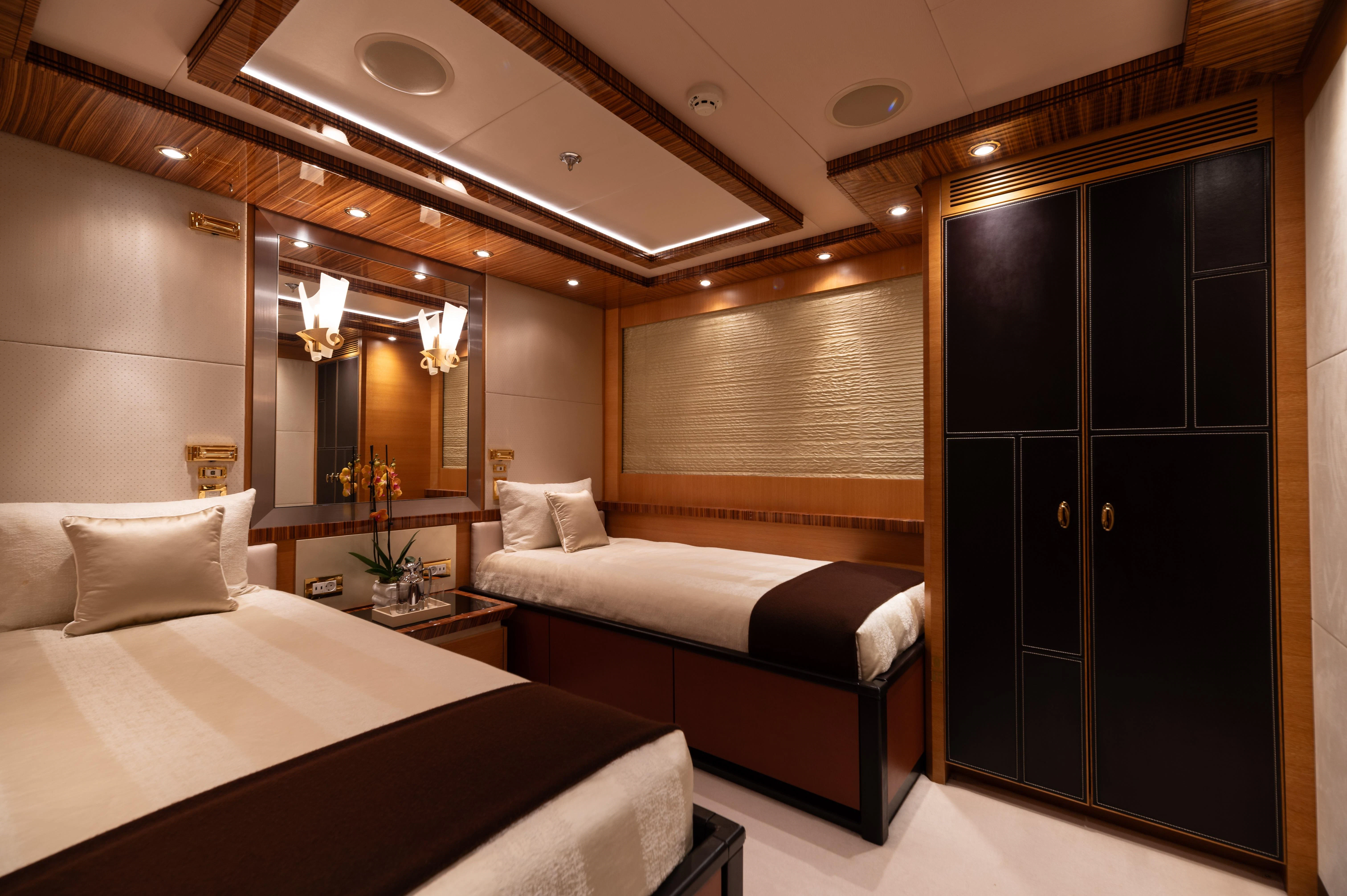 a room with two beds aboard HOKULANI Yacht for Sale