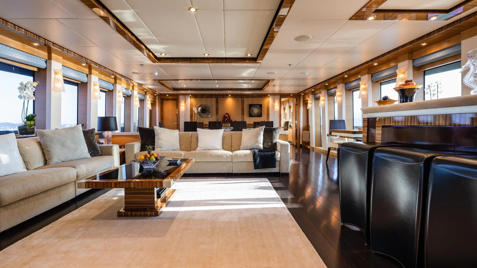a living room with a couch and a coffee table aboard HOKULANI Yacht for Sale
