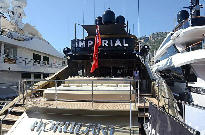 a large black boat docked aboard HOKULANI Yacht for Sale