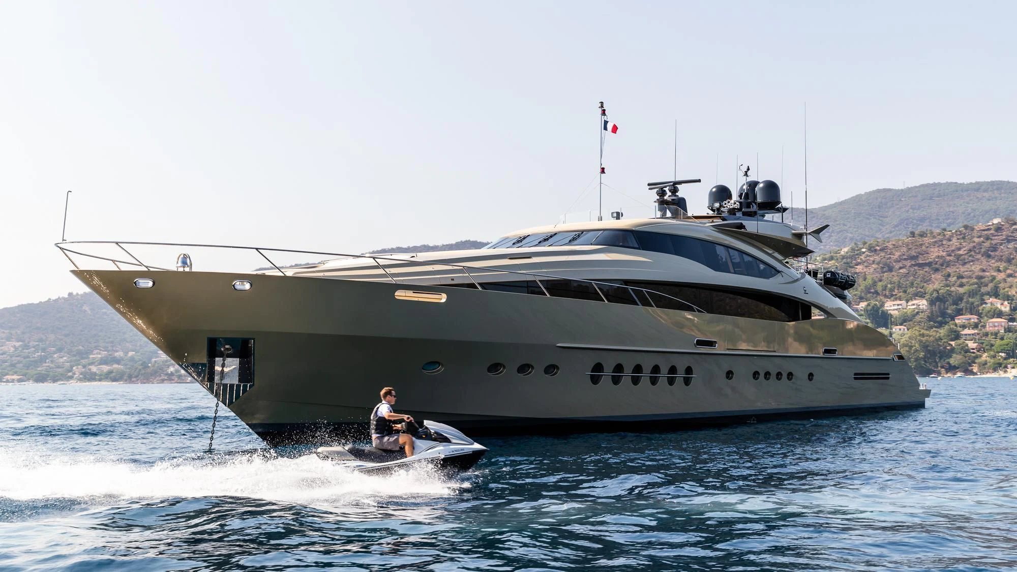 a large ship in the water aboard HOKULANI Yacht for Sale