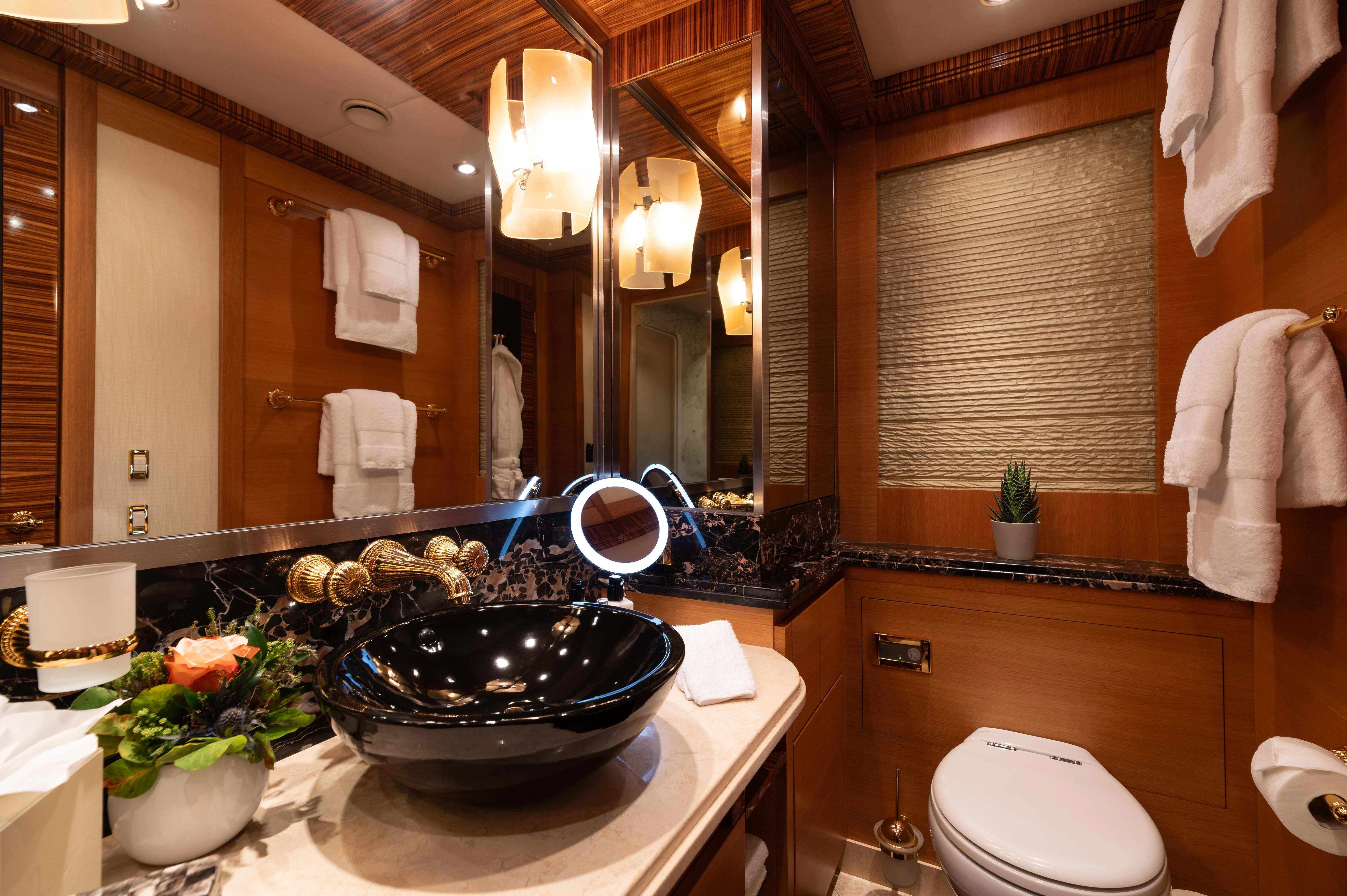 a bathroom with a large mirror aboard HOKULANI Yacht for Sale