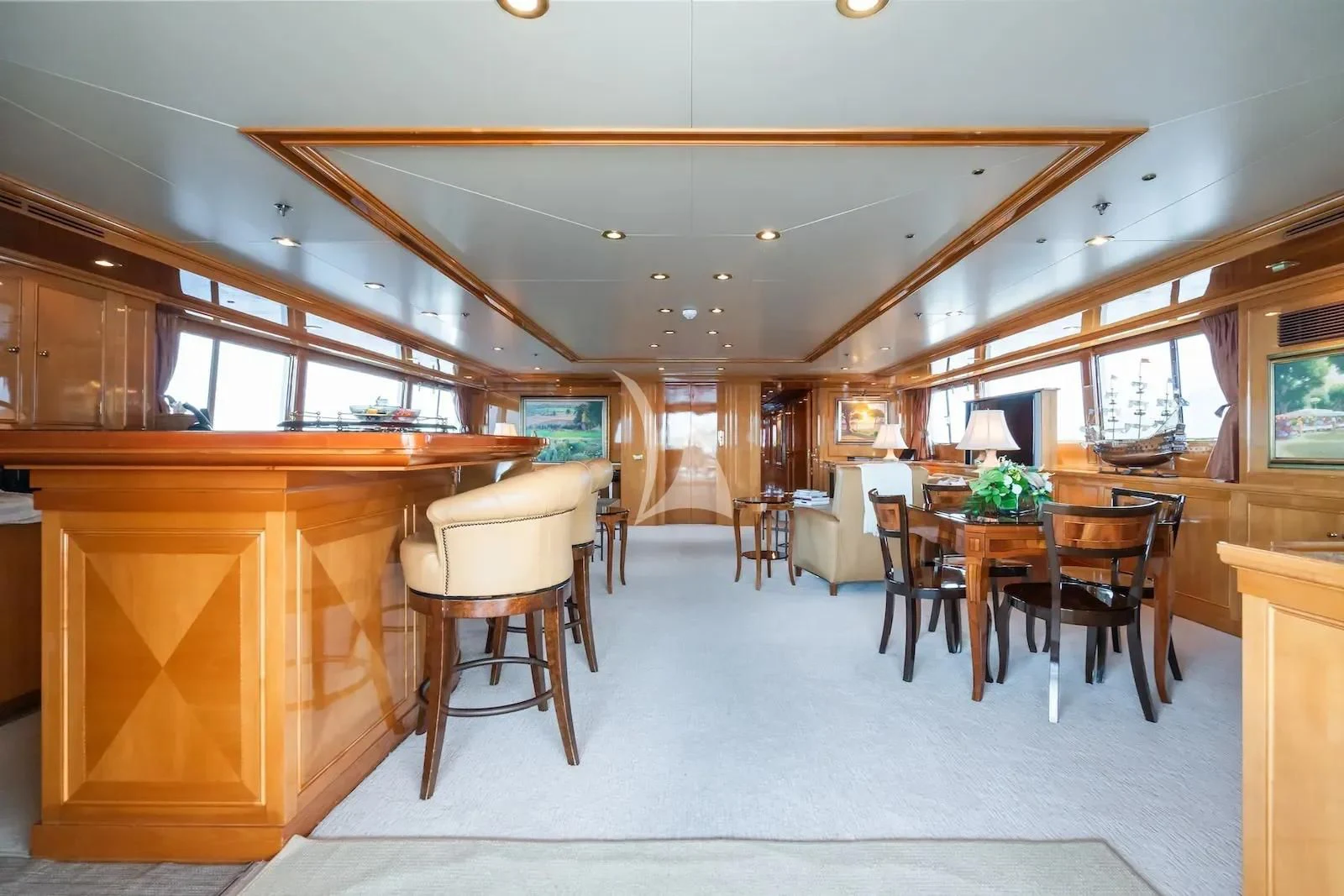 a room with a table and chairs aboard TE MANU Yacht for Charter