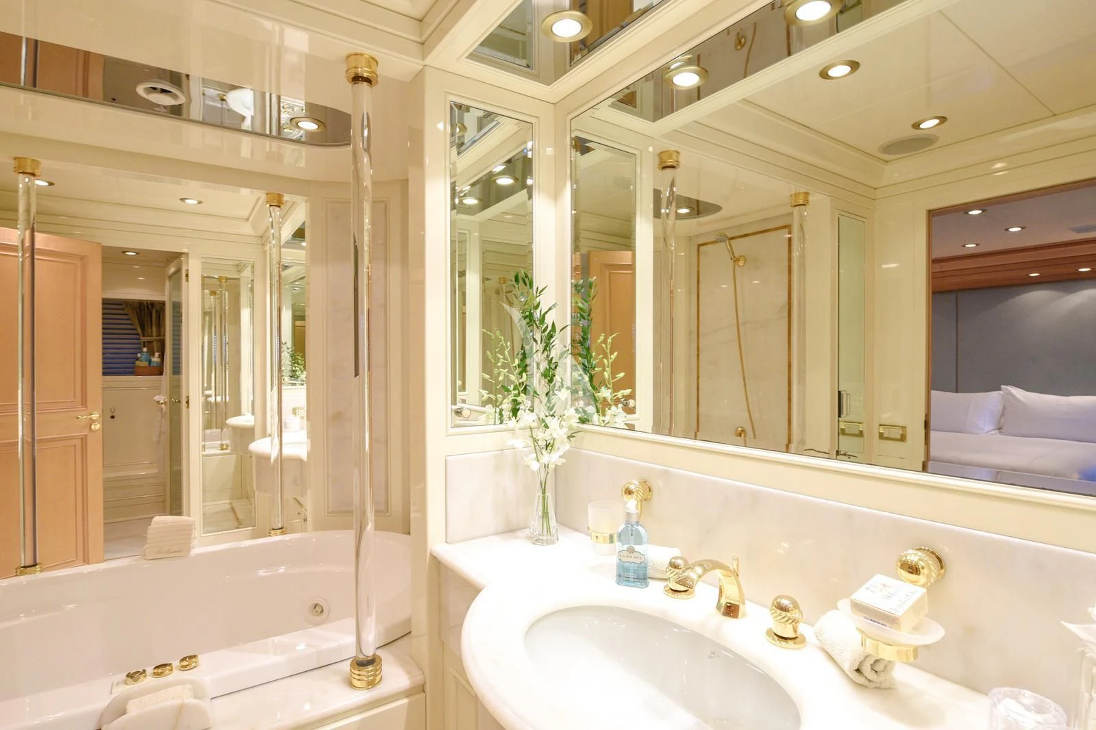 a bathroom with a large mirror aboard TE MANU Yacht for Charter